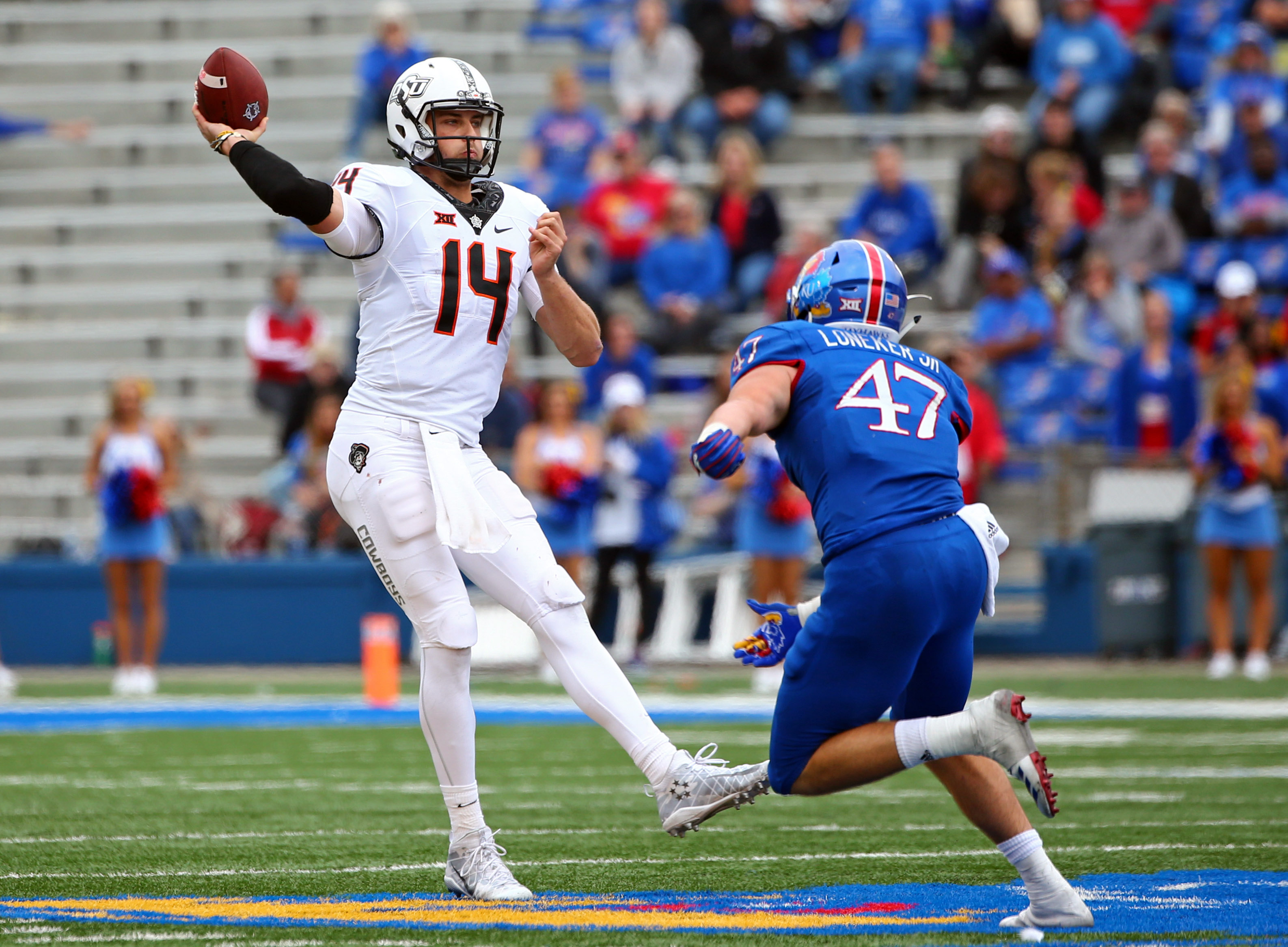 Cornelius leads Oklahoma State to 48-28 rout of Kansas