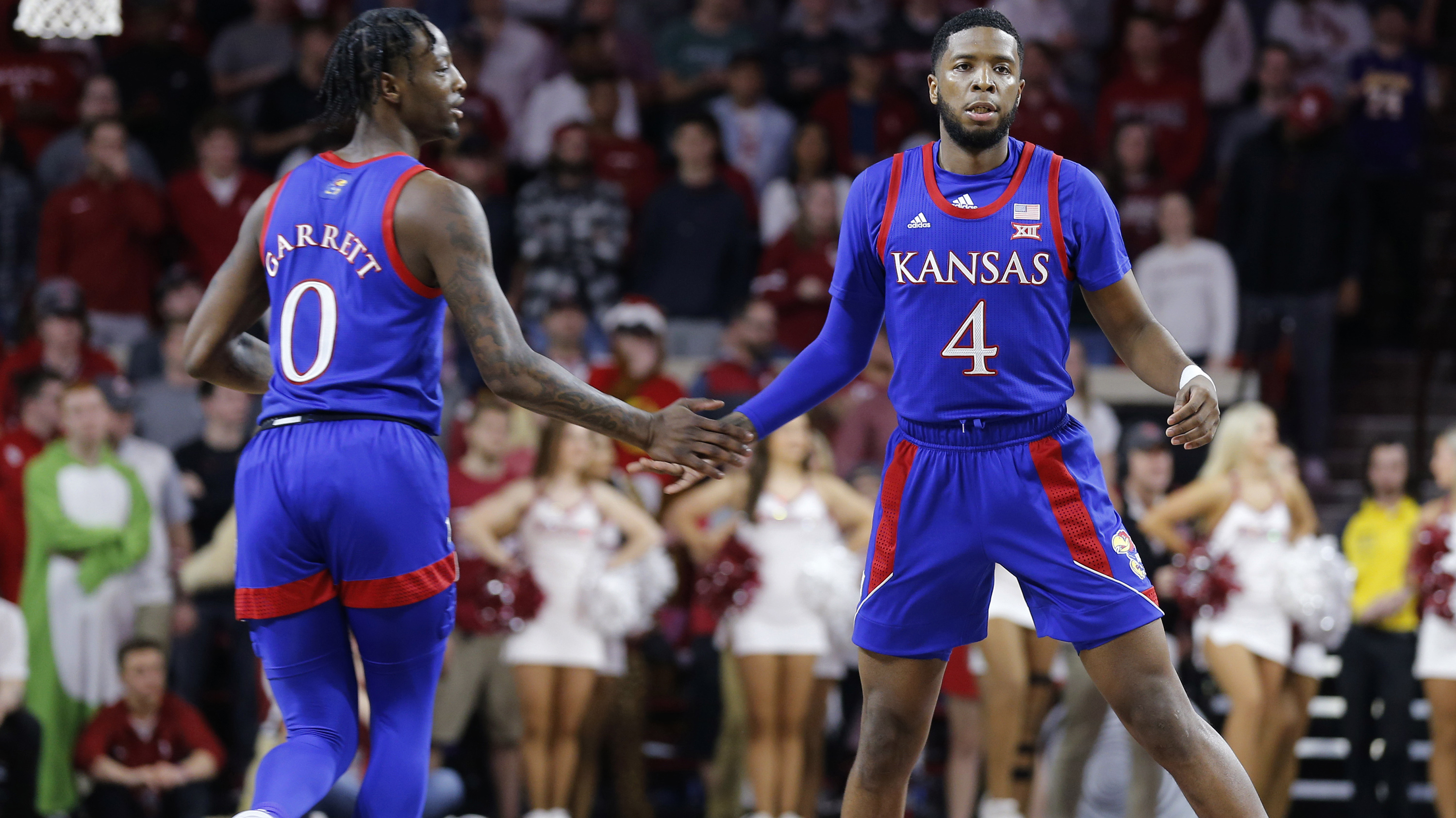 Moss scores 20 in Jayhawks' 66-52 win over Sooners