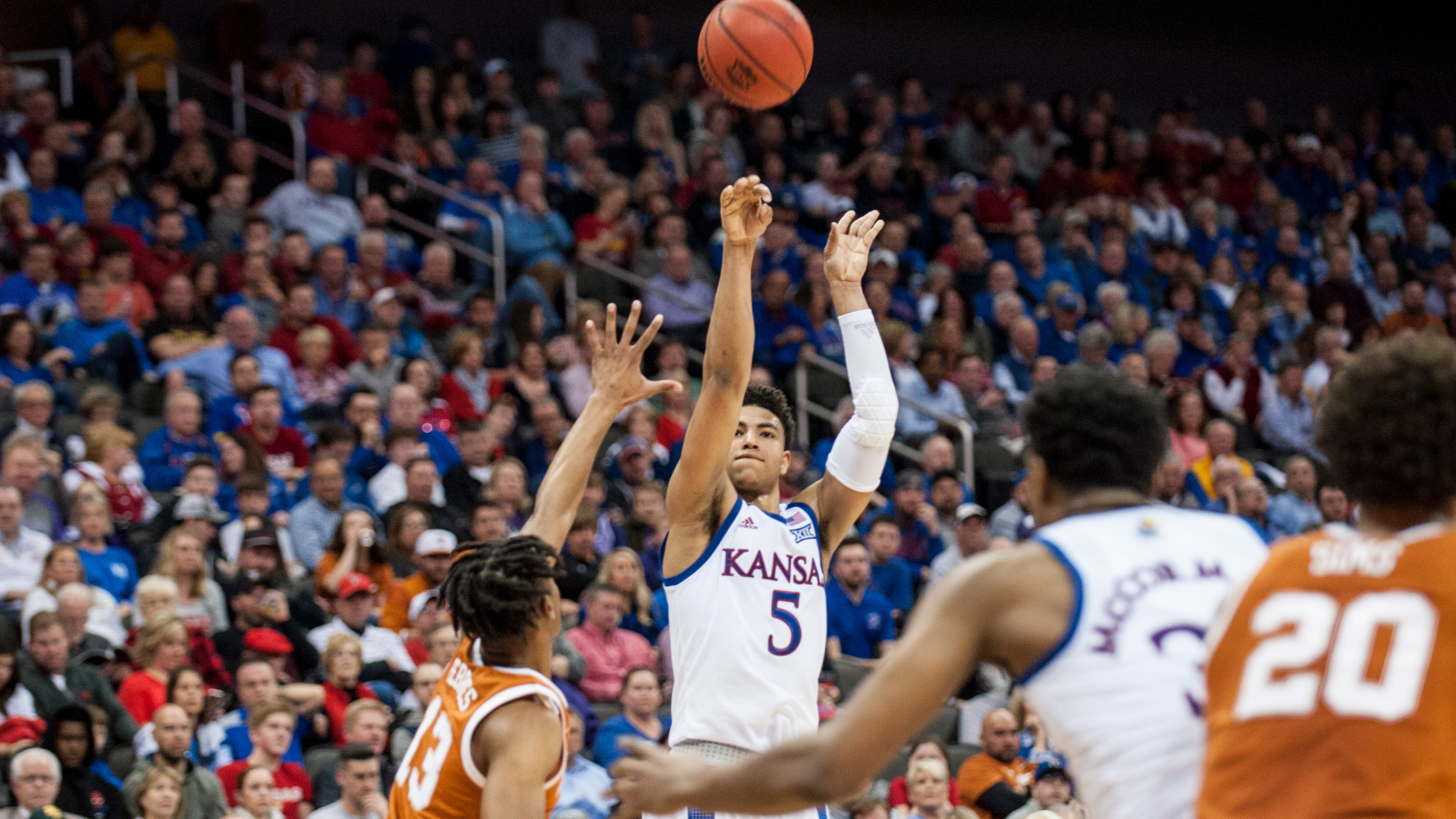 Kansas fends off Texas 65-57 to advance to Big 12 semifinals