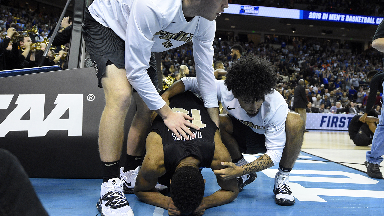 UCF coach Johnny Dawkins, son Aubrey Dawkins dealing with the "heartbreak" after game-winner rims out vs. Duke