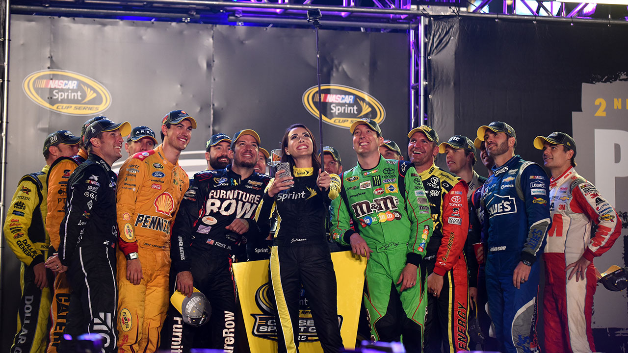 Low blow: Kyle Busch gives Clint Bowyer love tap before Chase picture