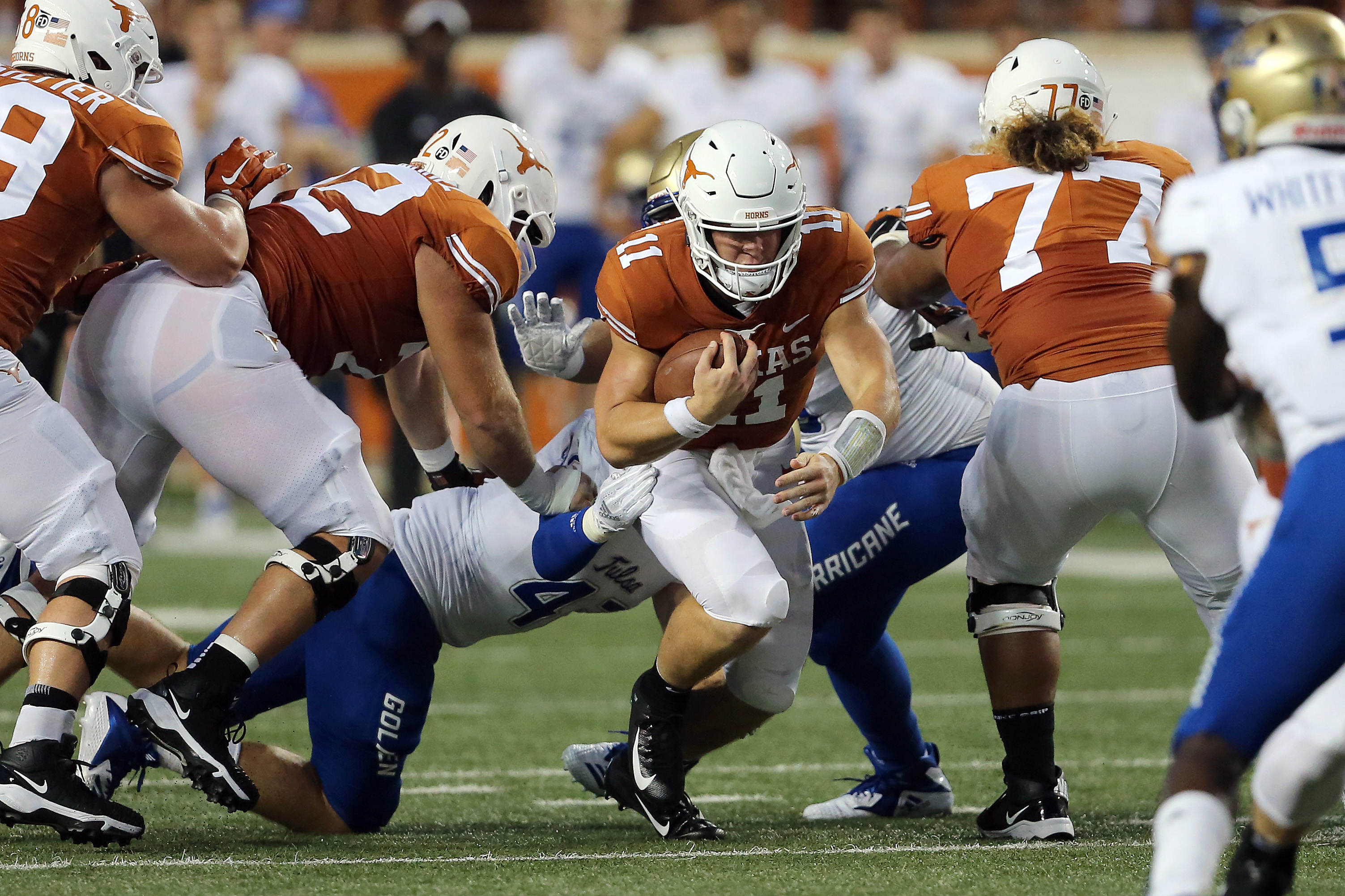 Ehlinger leads Texas to grinding win over Tulsa 28-21