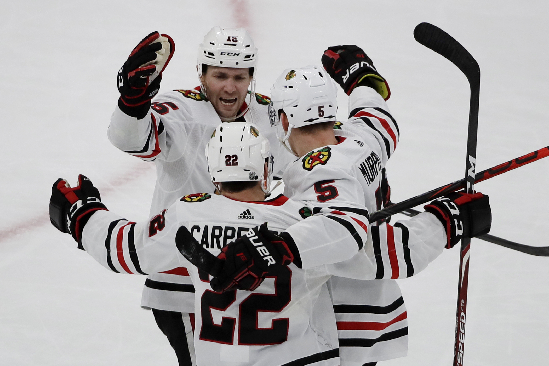 Blackhawks recover, beat Bruins 4-3 in OT