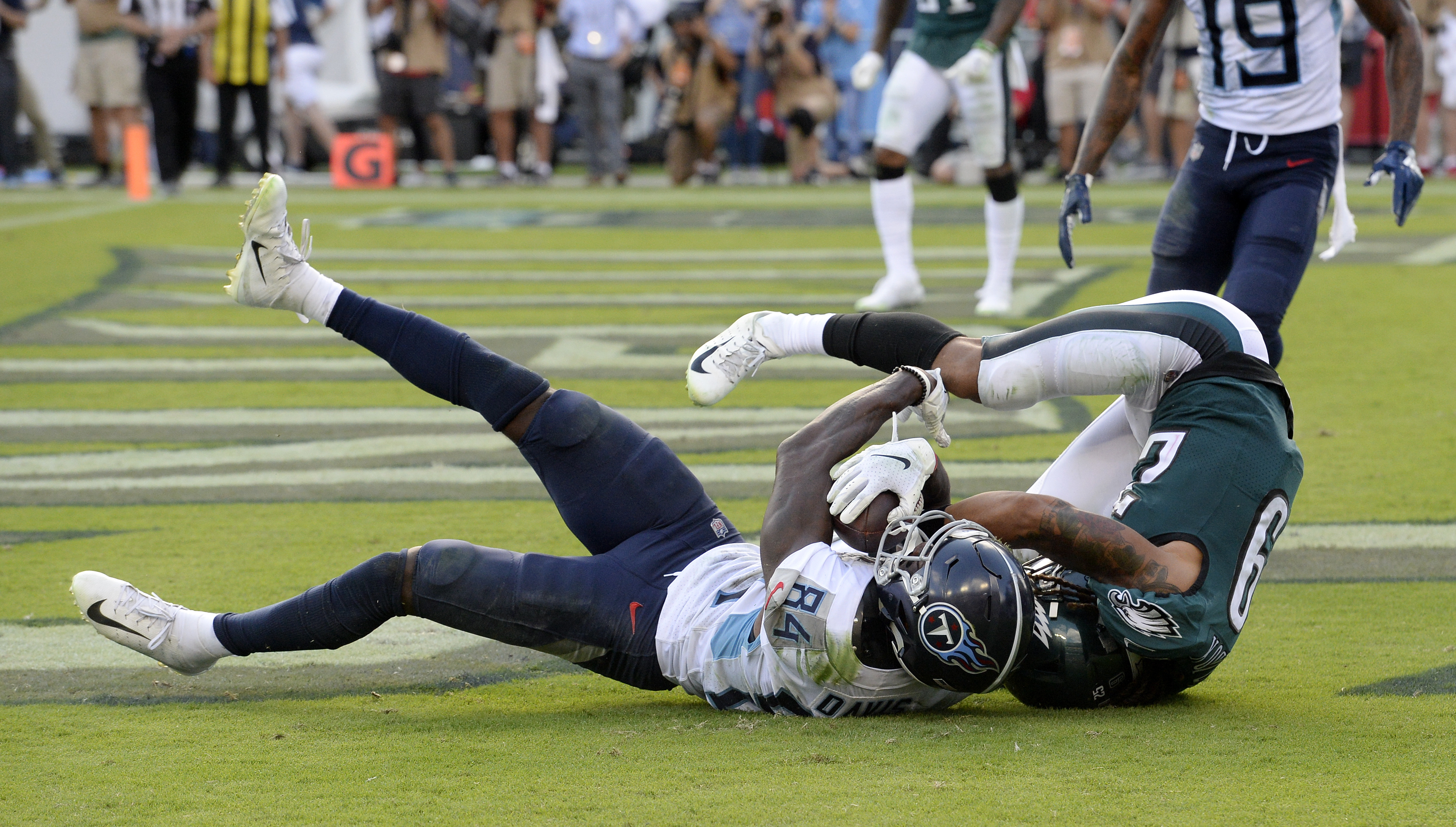 Titans edge Eagles 26-23 on TD pass late in OT
