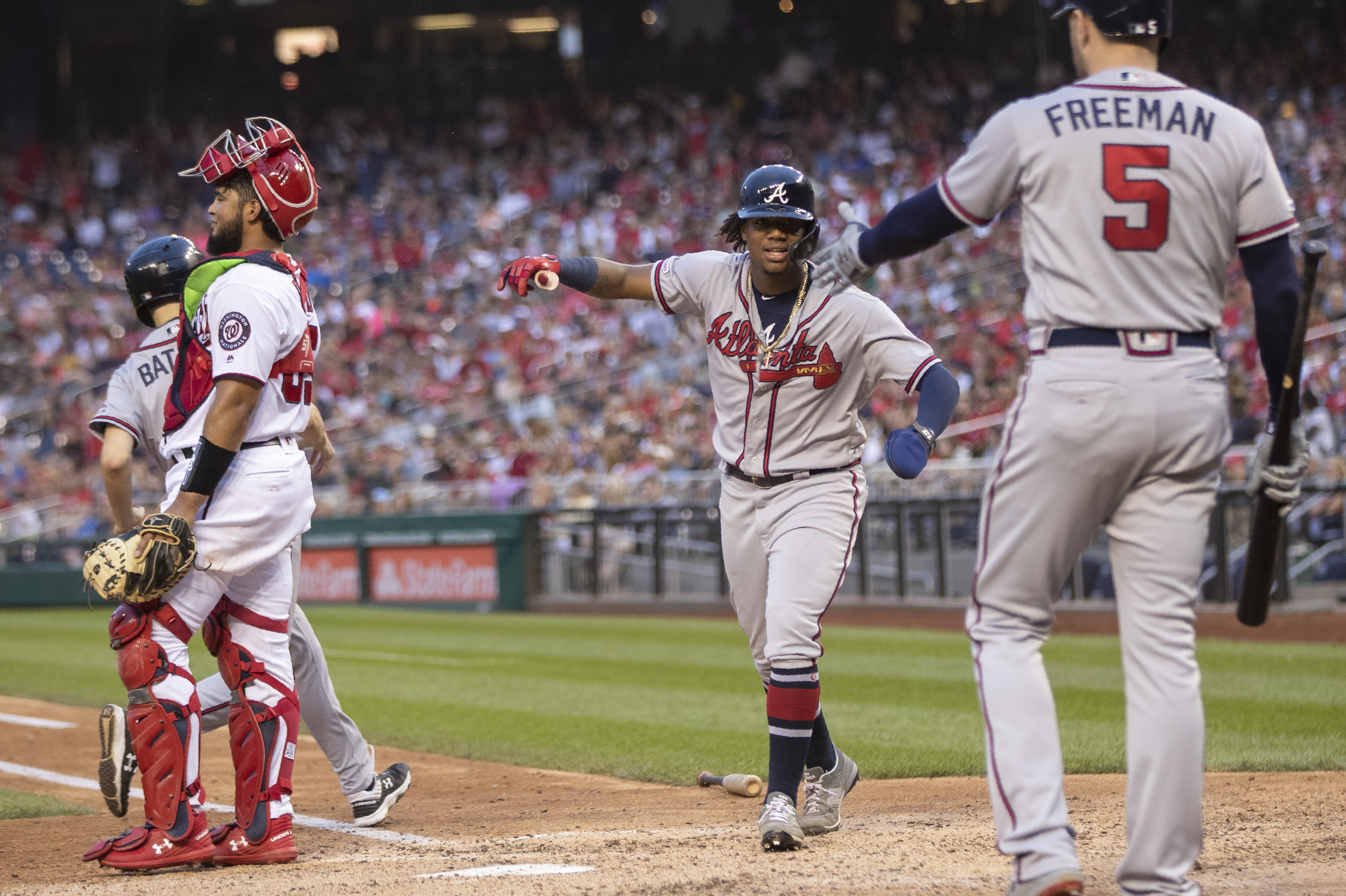 Braves clinch playoff spot behind Acuña Jr.