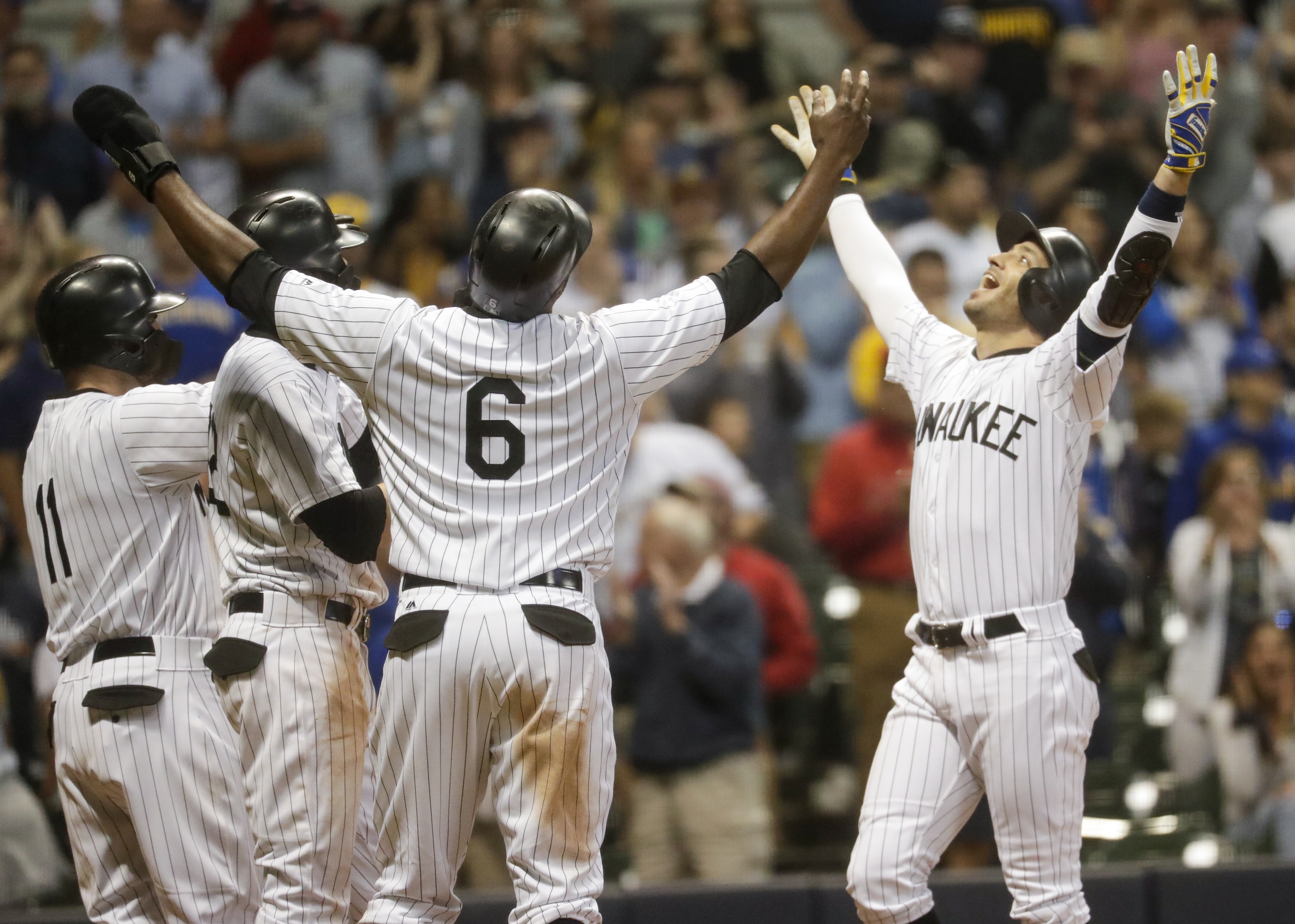 Woodruff fans 10, Brewers' bats shine in 10-4 win over Bucs