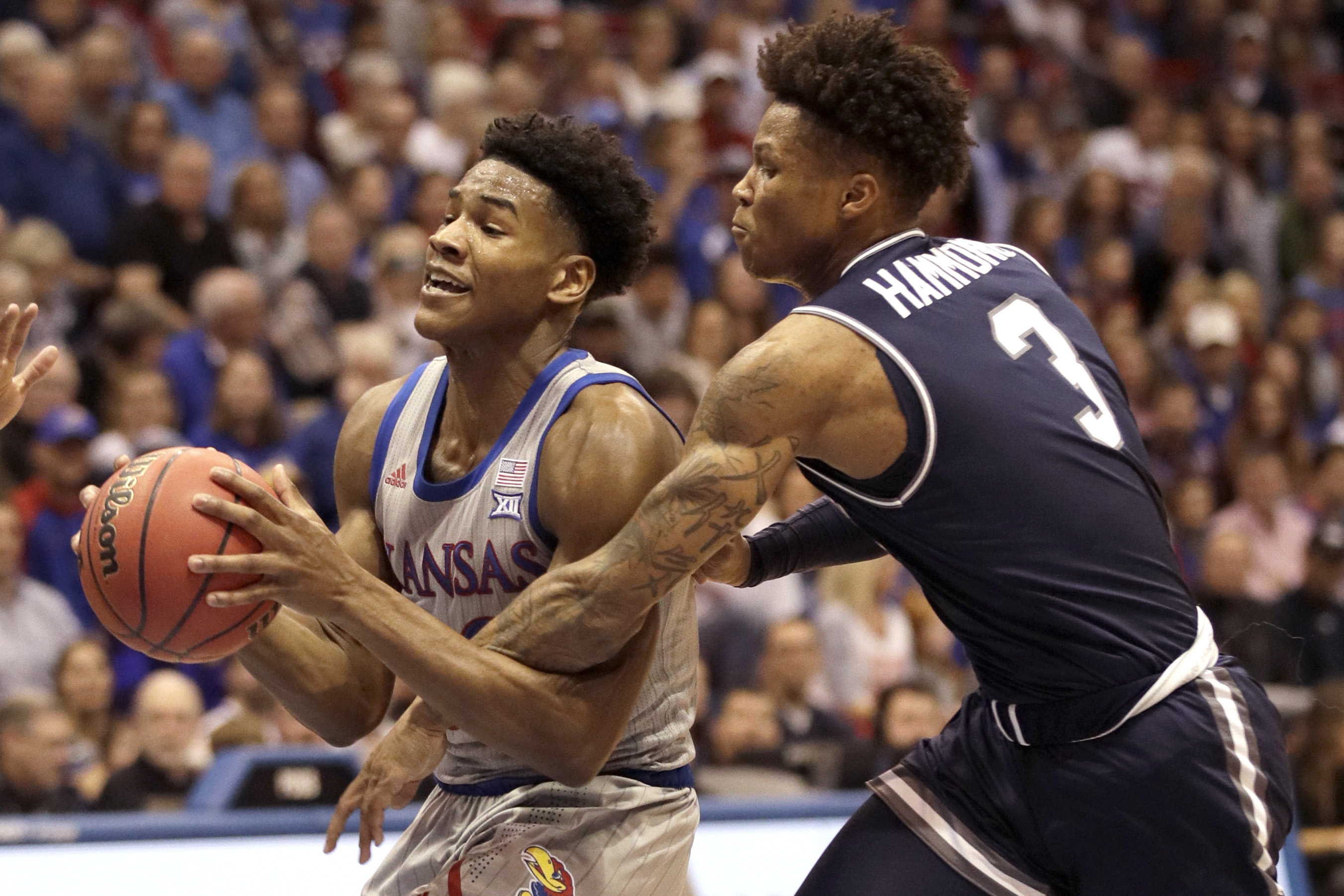 Moss leads No. 5 Kansas to 112-57 romp over Monmouth