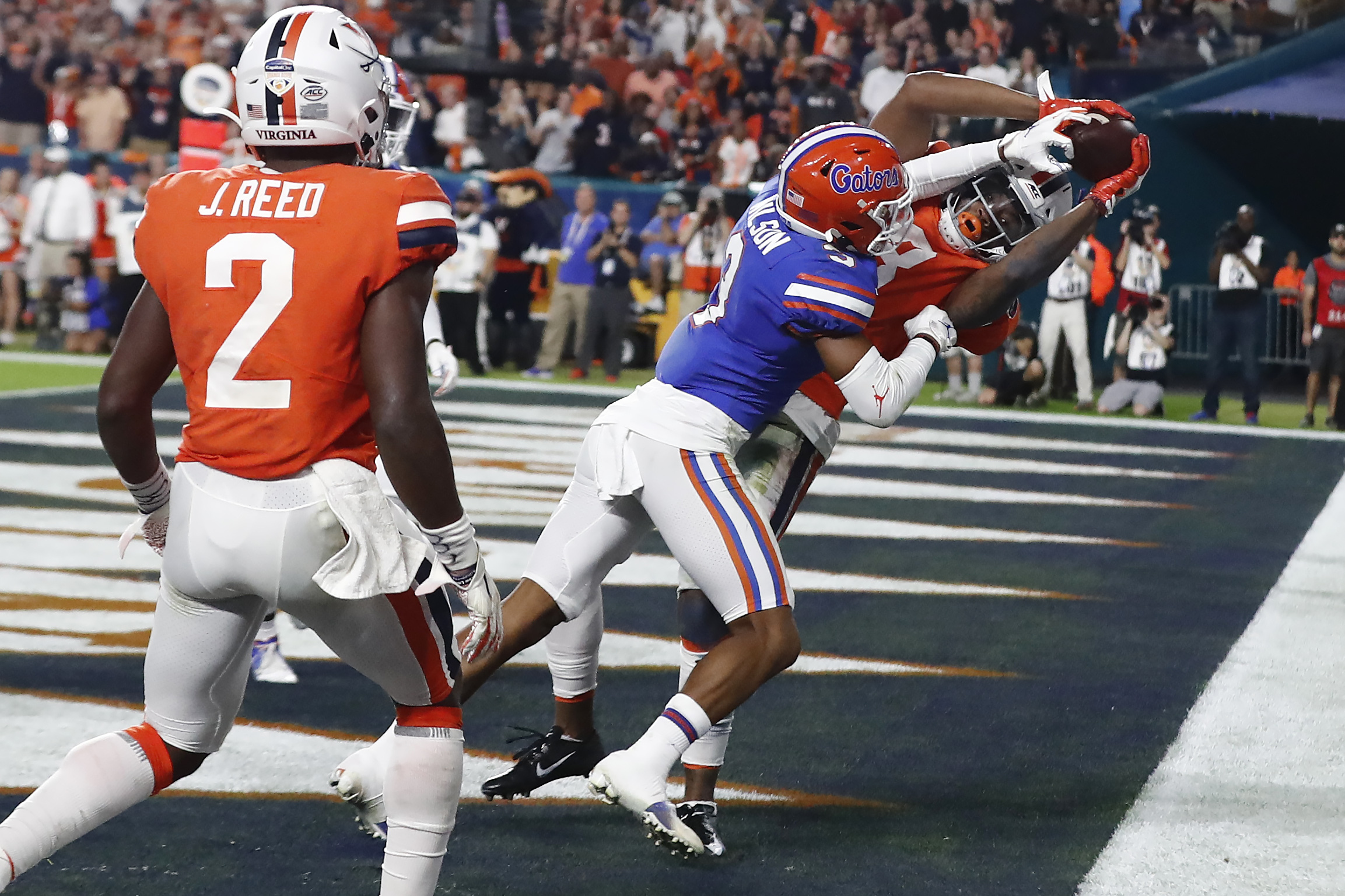 Perine leads No. 6 Gators past Virginia 36-28 in Orange Bowl