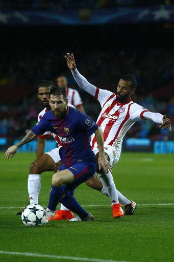Messi nets 100th goal in Europe, Barca beats Olympiakos 3-1