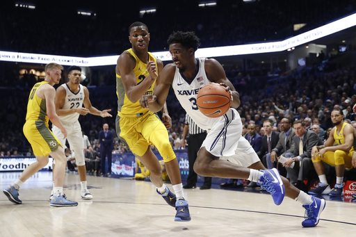 Goodin leads No. 8 Xavier to 89-70 rout of Marquette