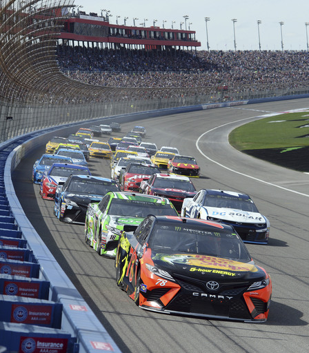 The Latest: Truex wins 1st stage at Fontana; Harvick wrecks