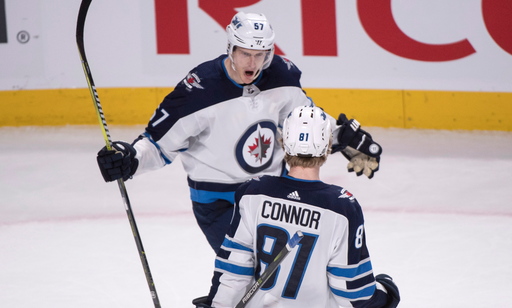 Jets reach 50 wins with 5-4 OT triumph over Canadiens