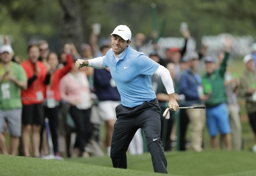 Reed wins first major title, holding off Fowler at Masters