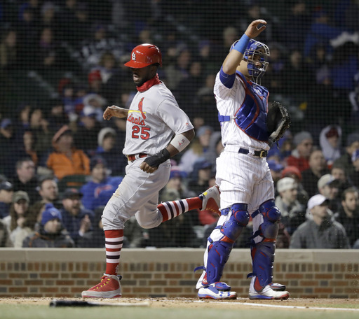Wainwright pitches Cardinals past Cubs at chilly Wrigley