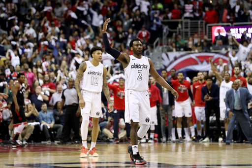 Wall takes over, Wiz beat Raps 106-98 to tie series at 2-2