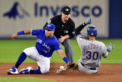 Almost 45, Colon pitches Texas over Toronto 7-4