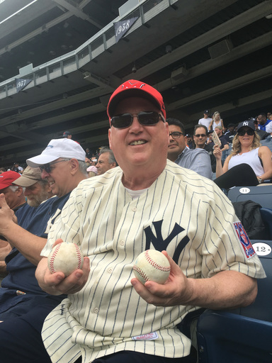 College hoops coach catches 2 foul balls at Yankee Stadium