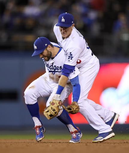 LEADING OFF: Dodgers seek spark in Miami, Pollock hurt