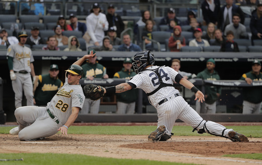 With help of reversal, Yanks top A’s 7-6, stop tiny skid