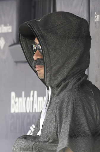 Ichi-who? Suzuki sits on M’s bench in fake mustache disguise