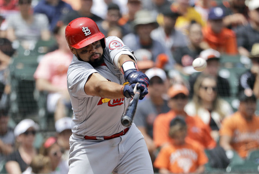 Martinez pitches, hits Cardinals past Giants 3-2