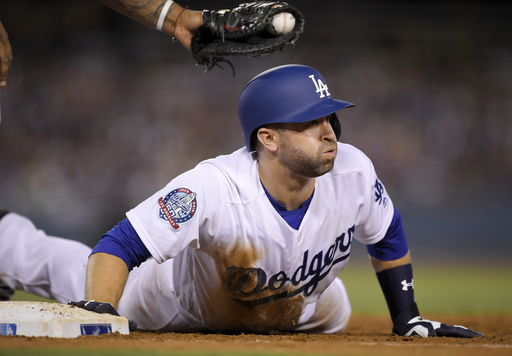 Grandal rallies Dodgers over Brewers 6-4 in 10