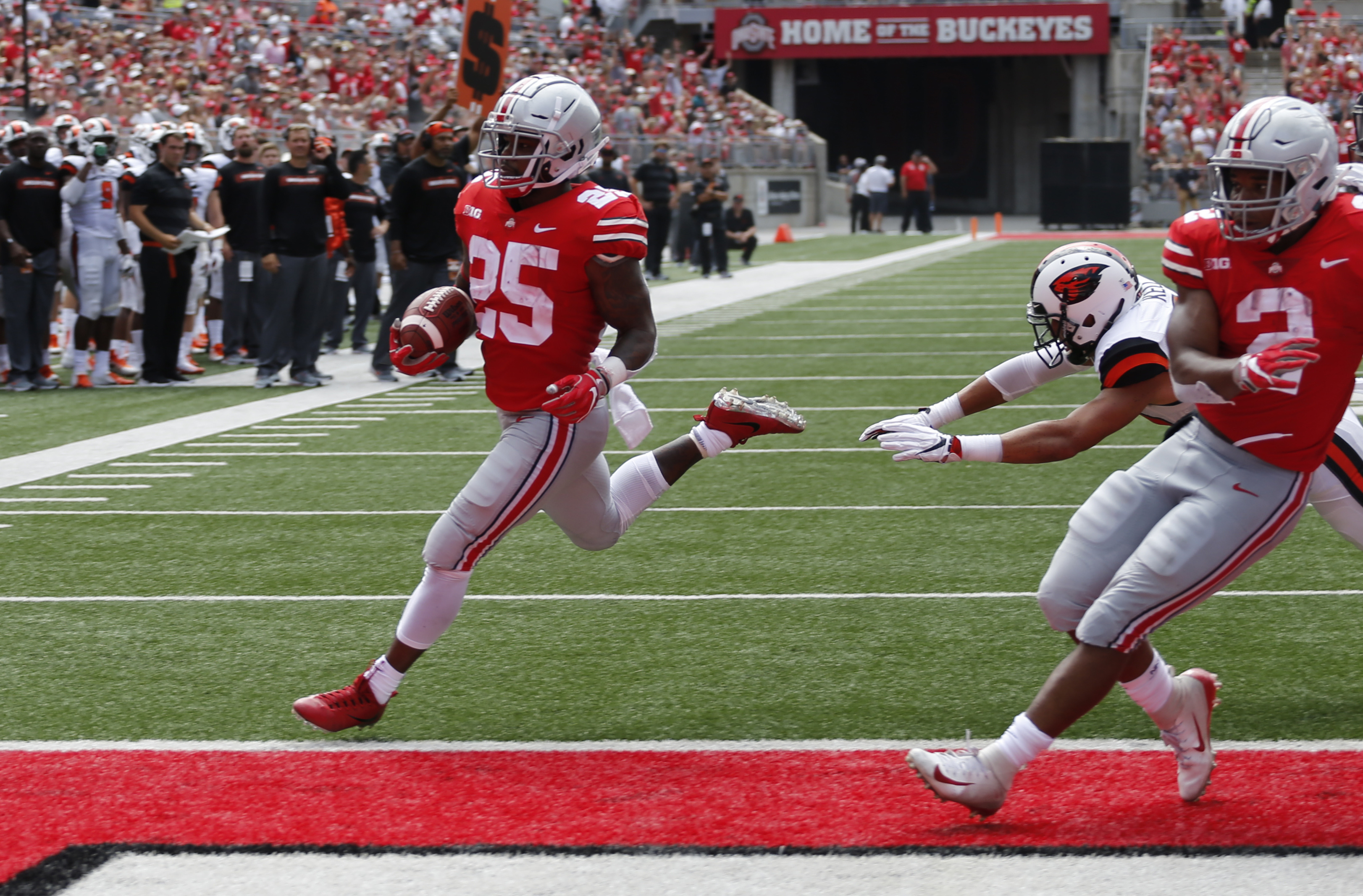 Urban-less Ohio State routs Oregon St 77-31 in opener