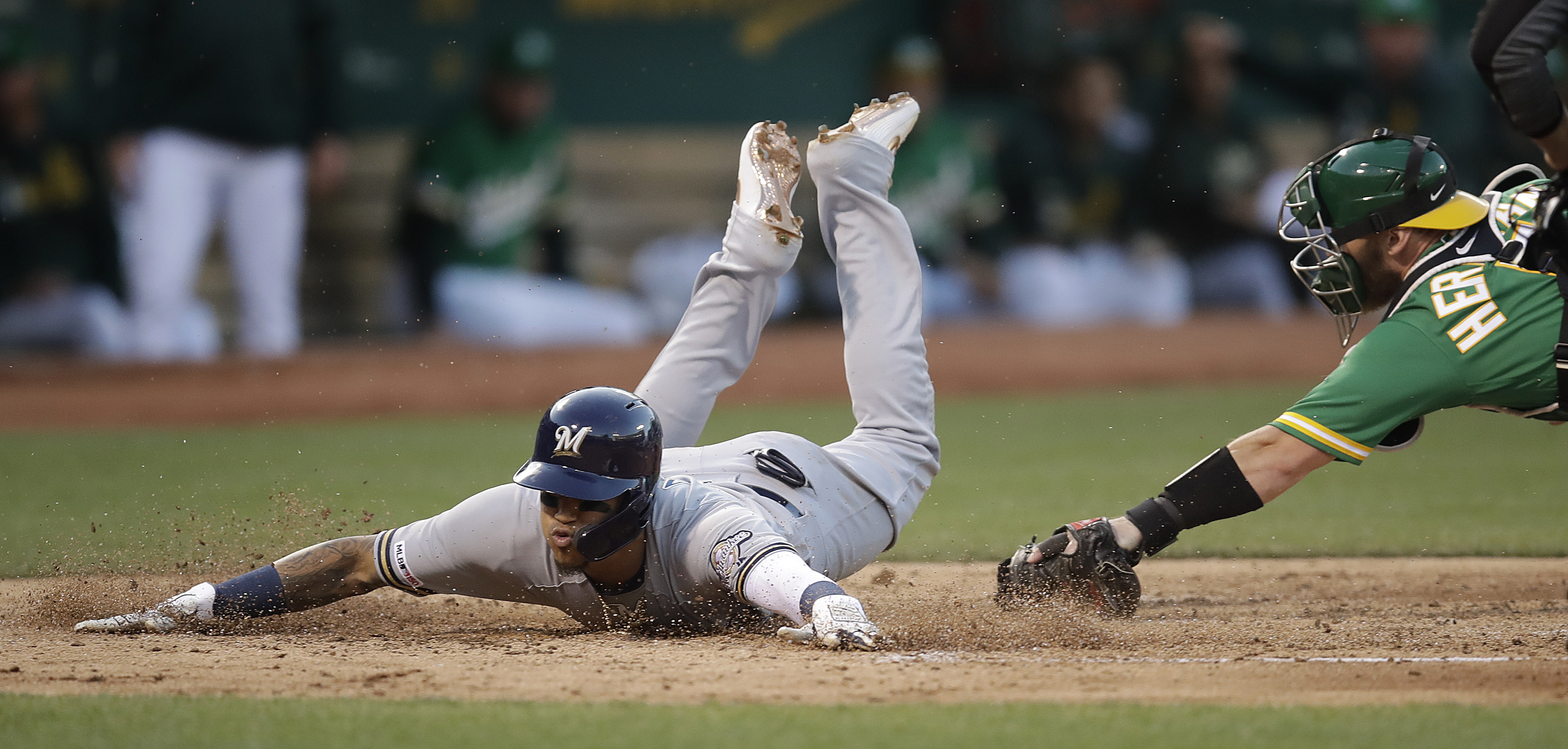 Jordan Lyles a winner in return to Brewers, 4-2 over A's