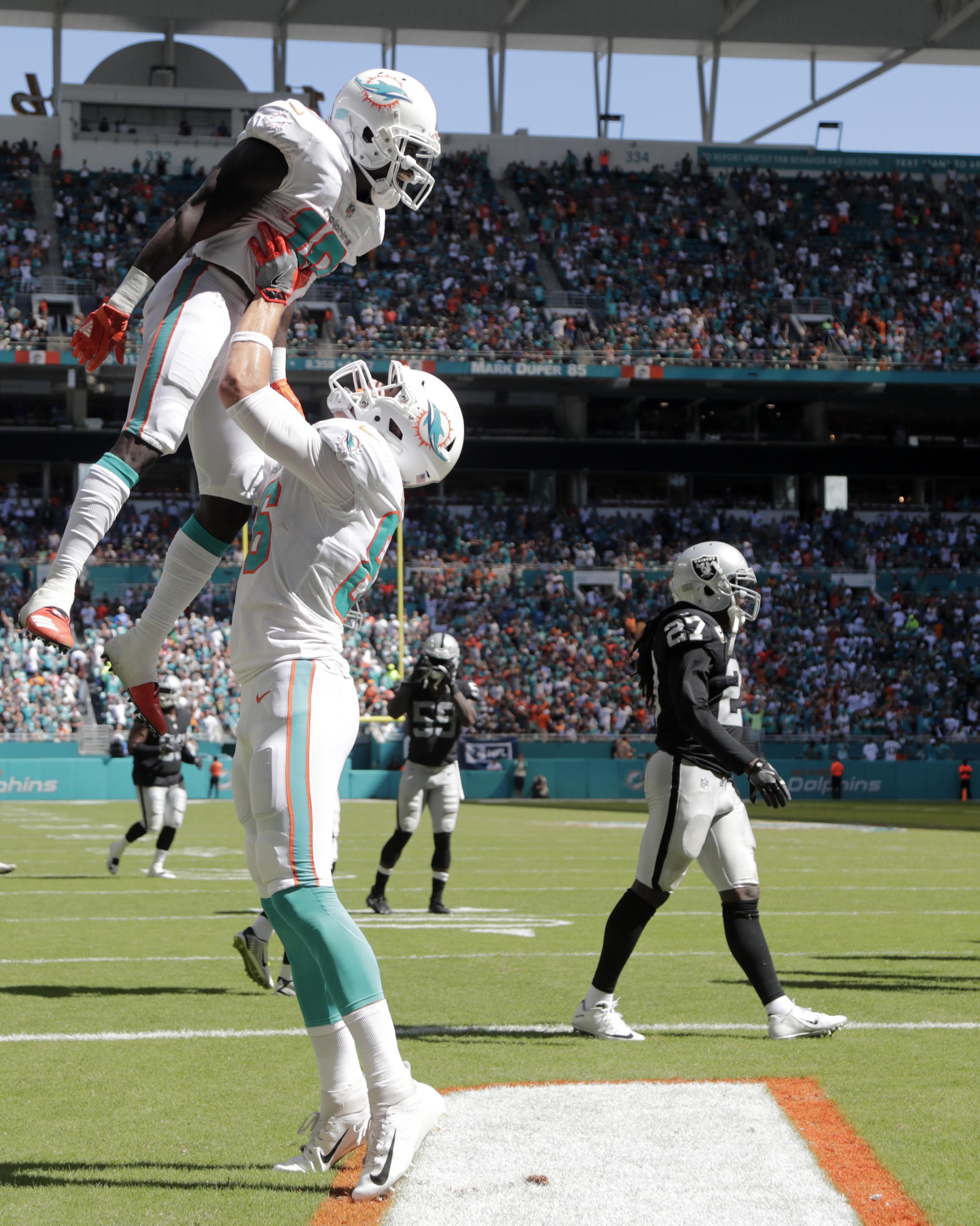 Trick plays help unbeaten Dolphins beat Raiders 28-20