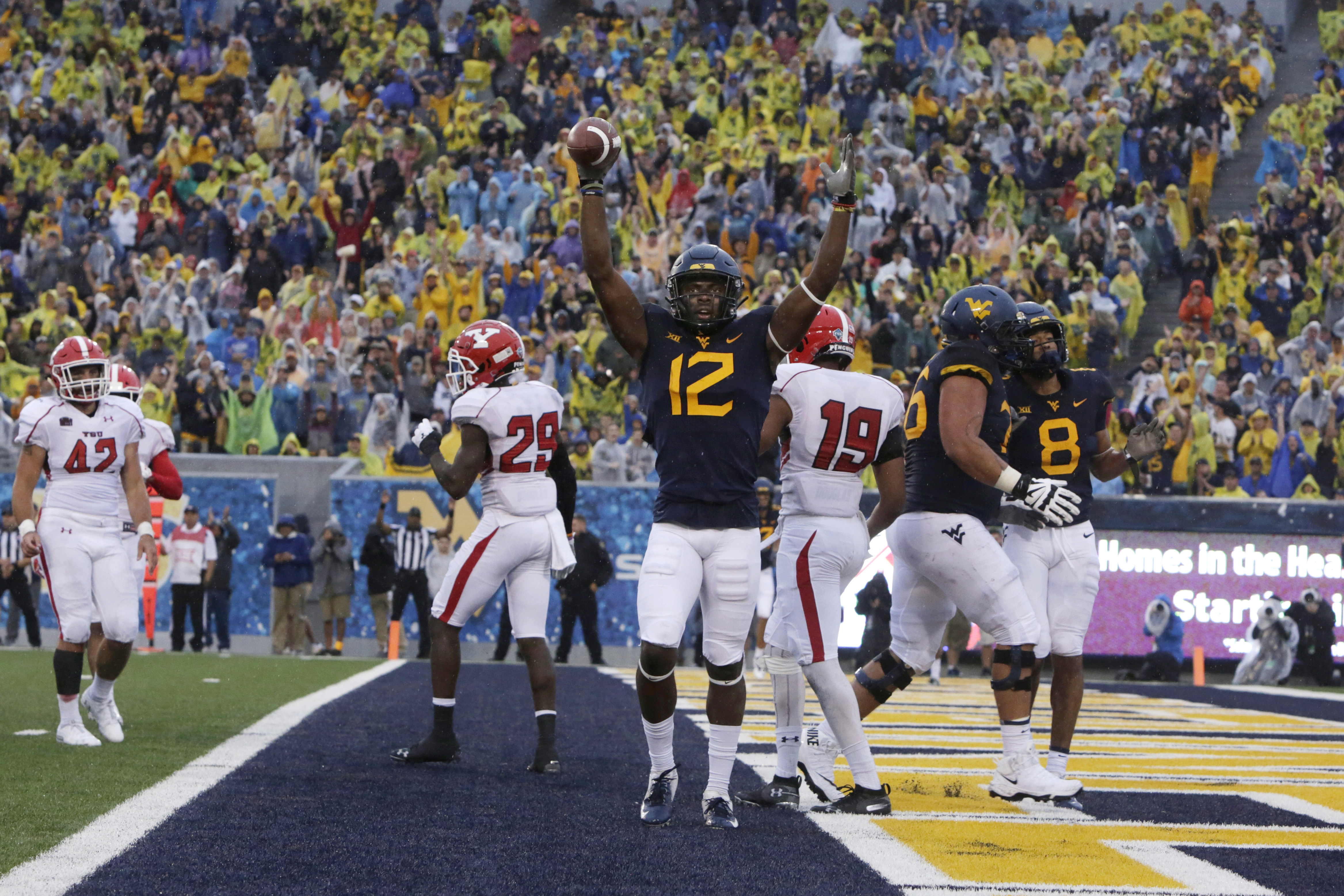 Grier throws 4 TDs, No. 14 WVU beats Youngstown State 52-17