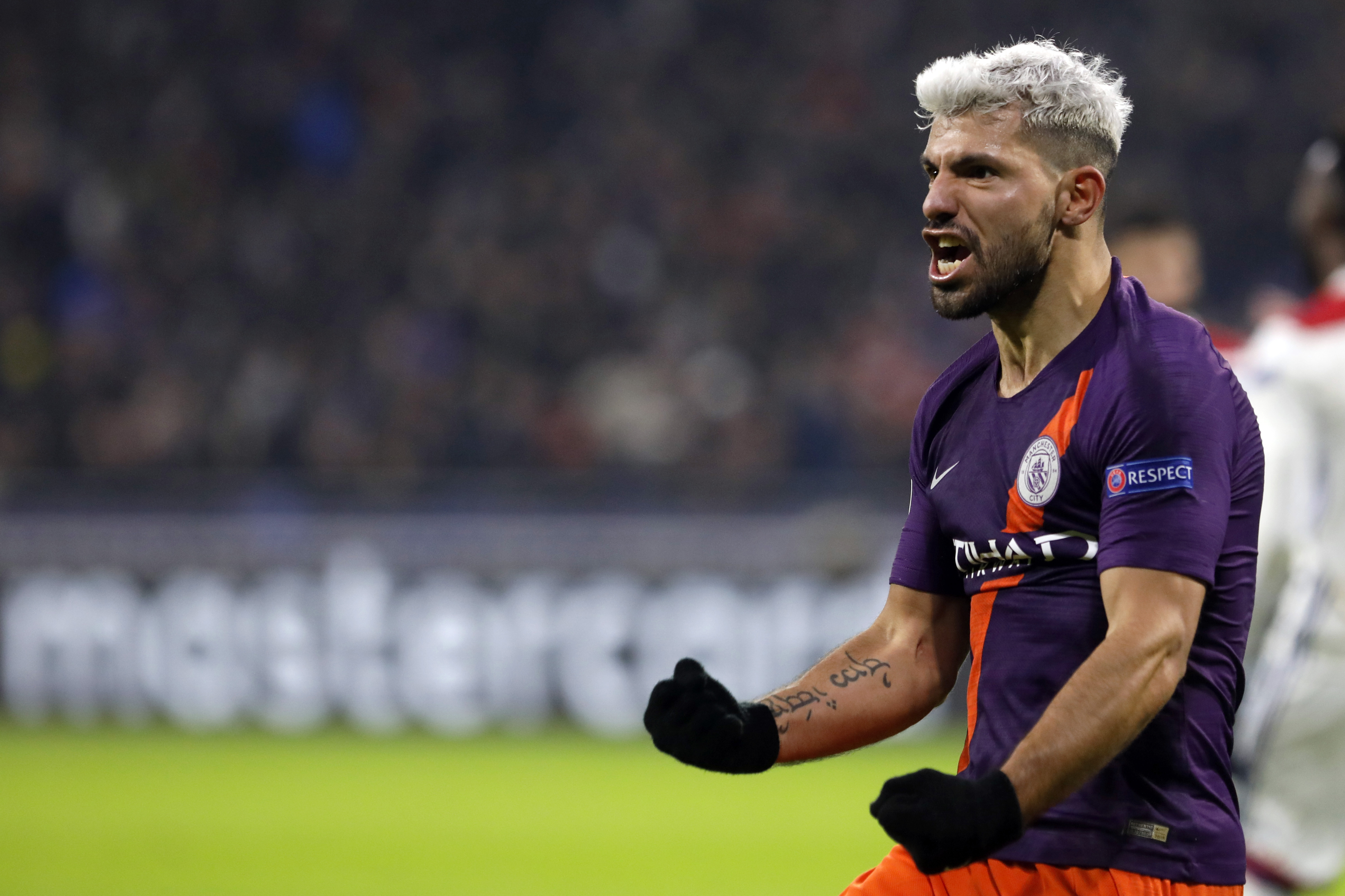 Man City advances in Champions League with 2-2 draw at Lyon