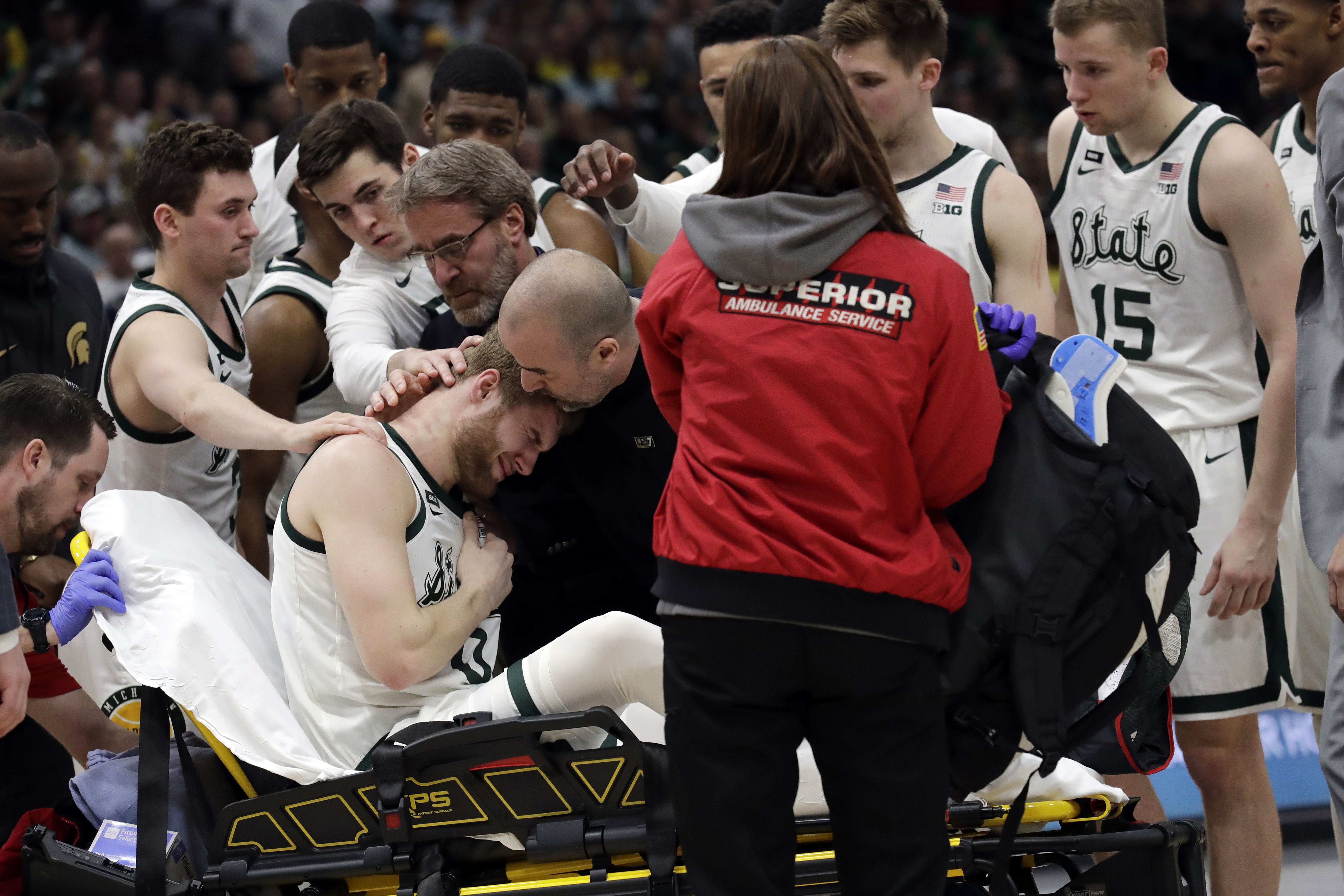 Michigan State’s Ahrens taken from court with leg injury