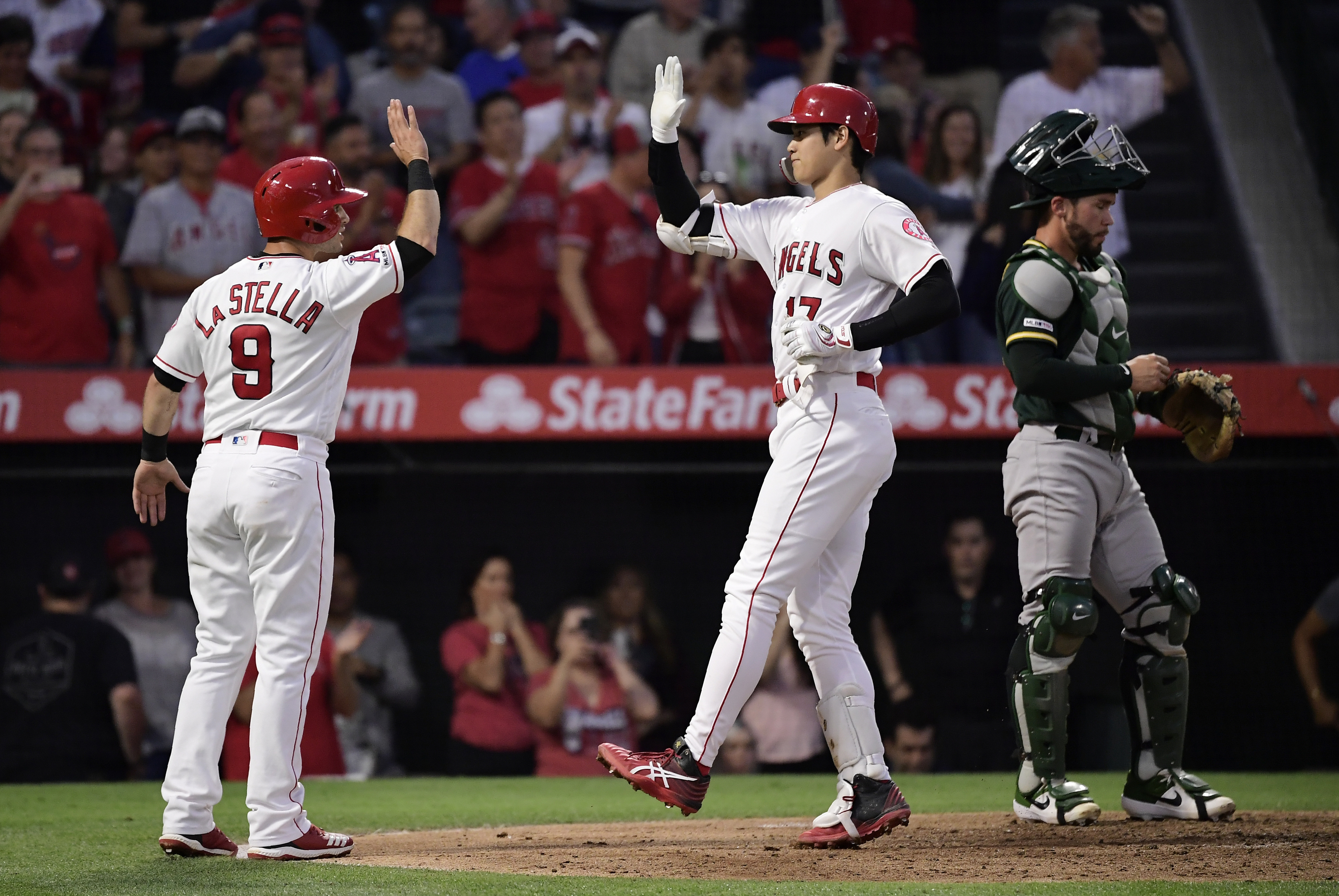 Ohtani, Calhoun help Angels win 4th straight, 8-3 over A's