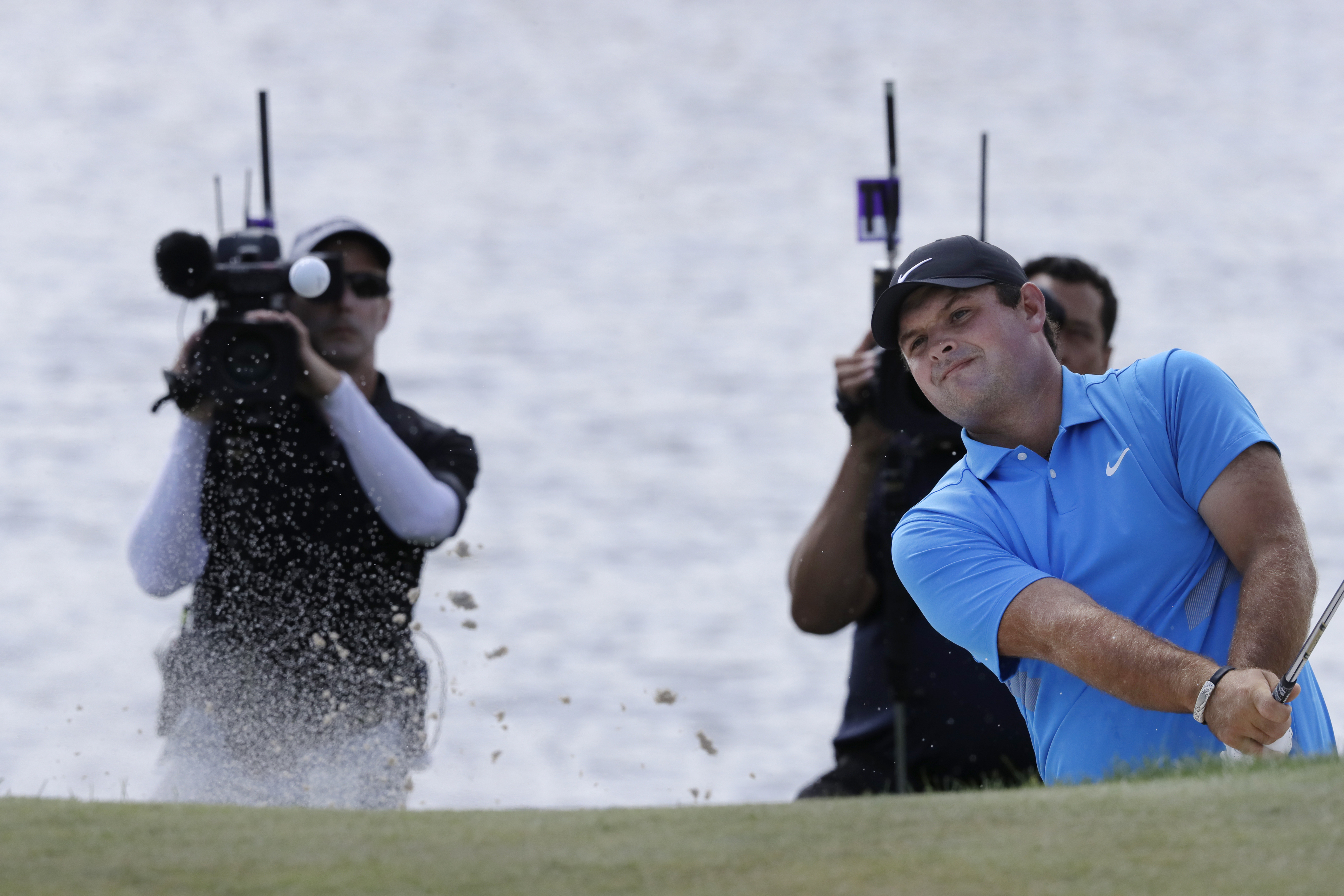 Reed delivers clutch putts to win FedEx Cup opener