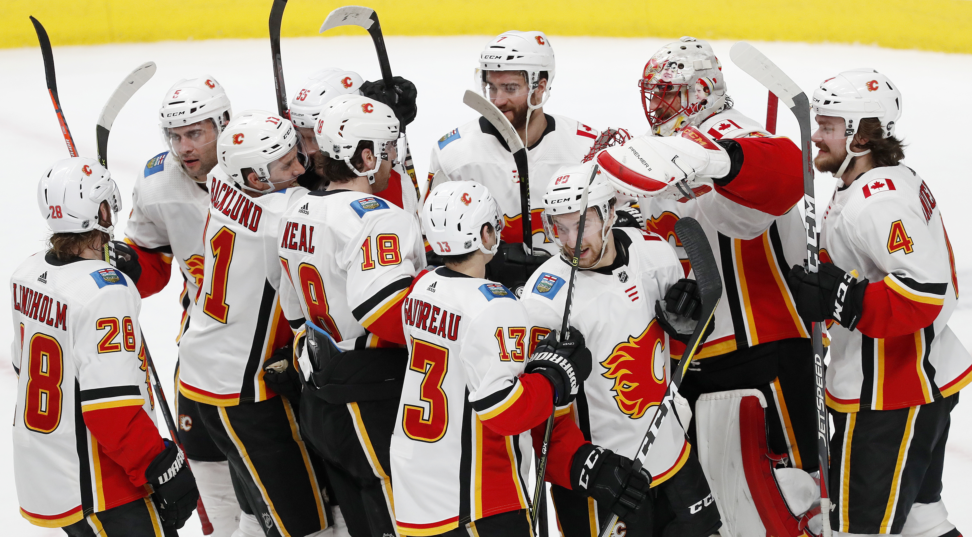 Flames top Sharks 5-3, clinch conference, division crowns