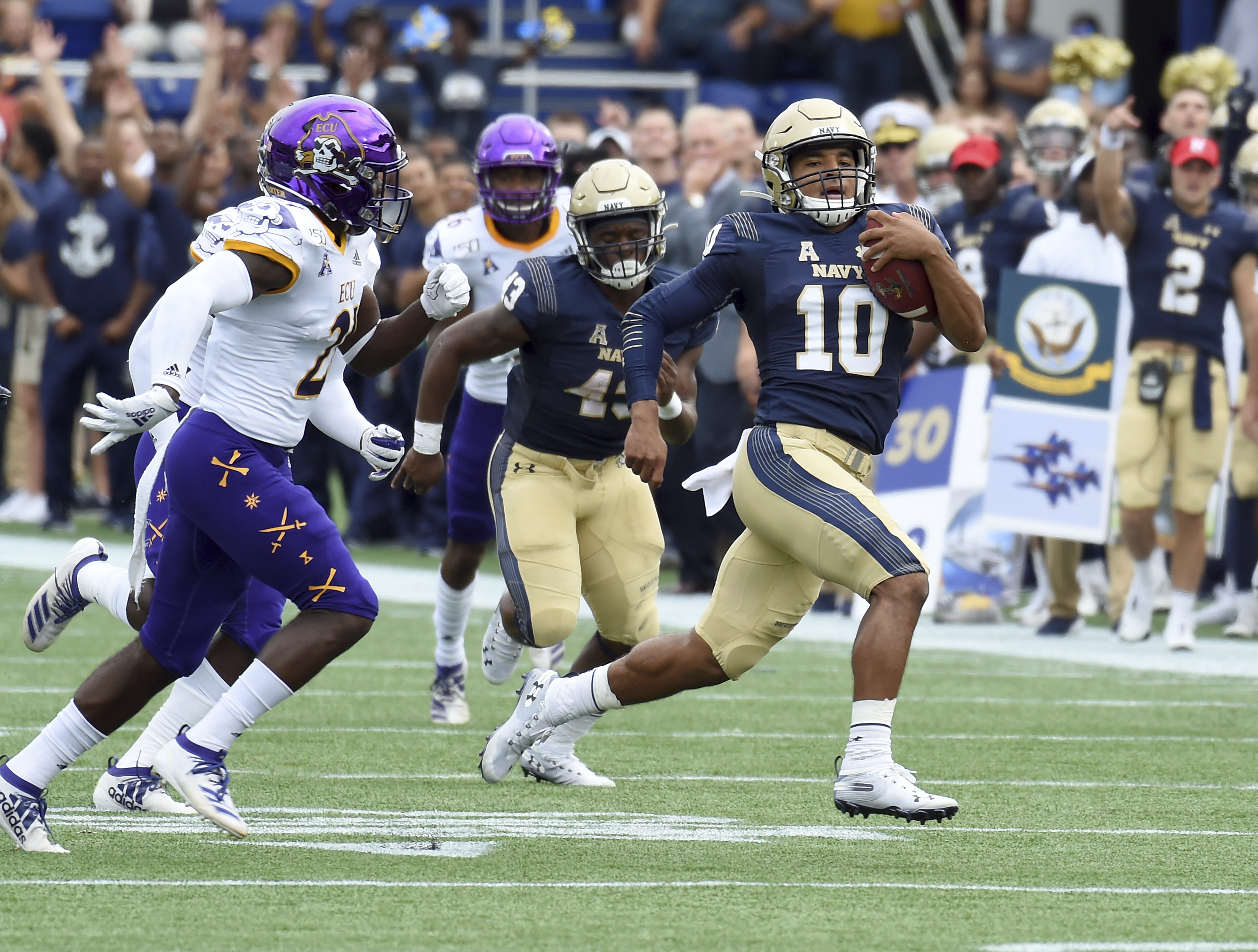 Perry runs, passes Navy past outclassed East Carolina 42-10