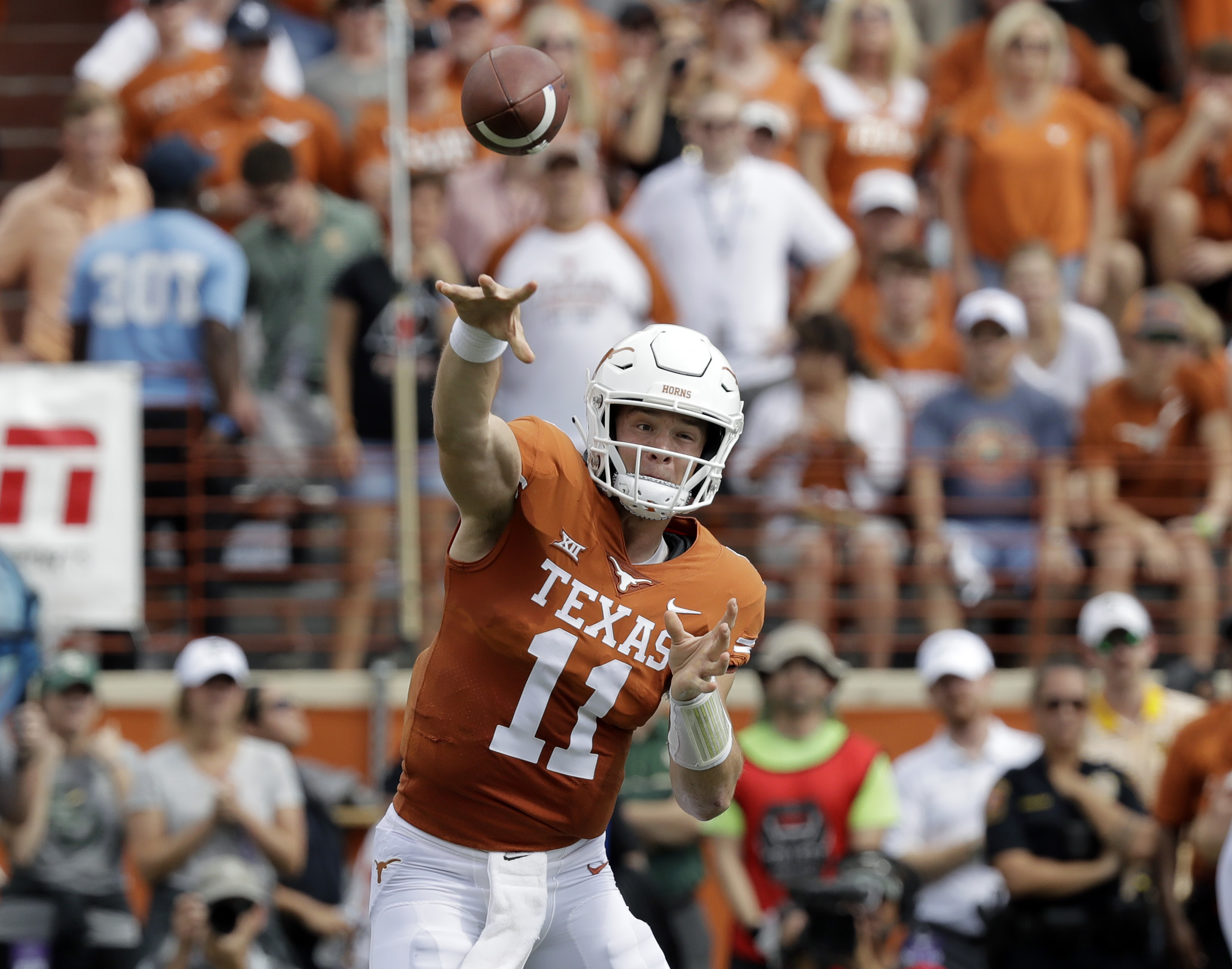 Texas QB Ehlinger leaves game with injury