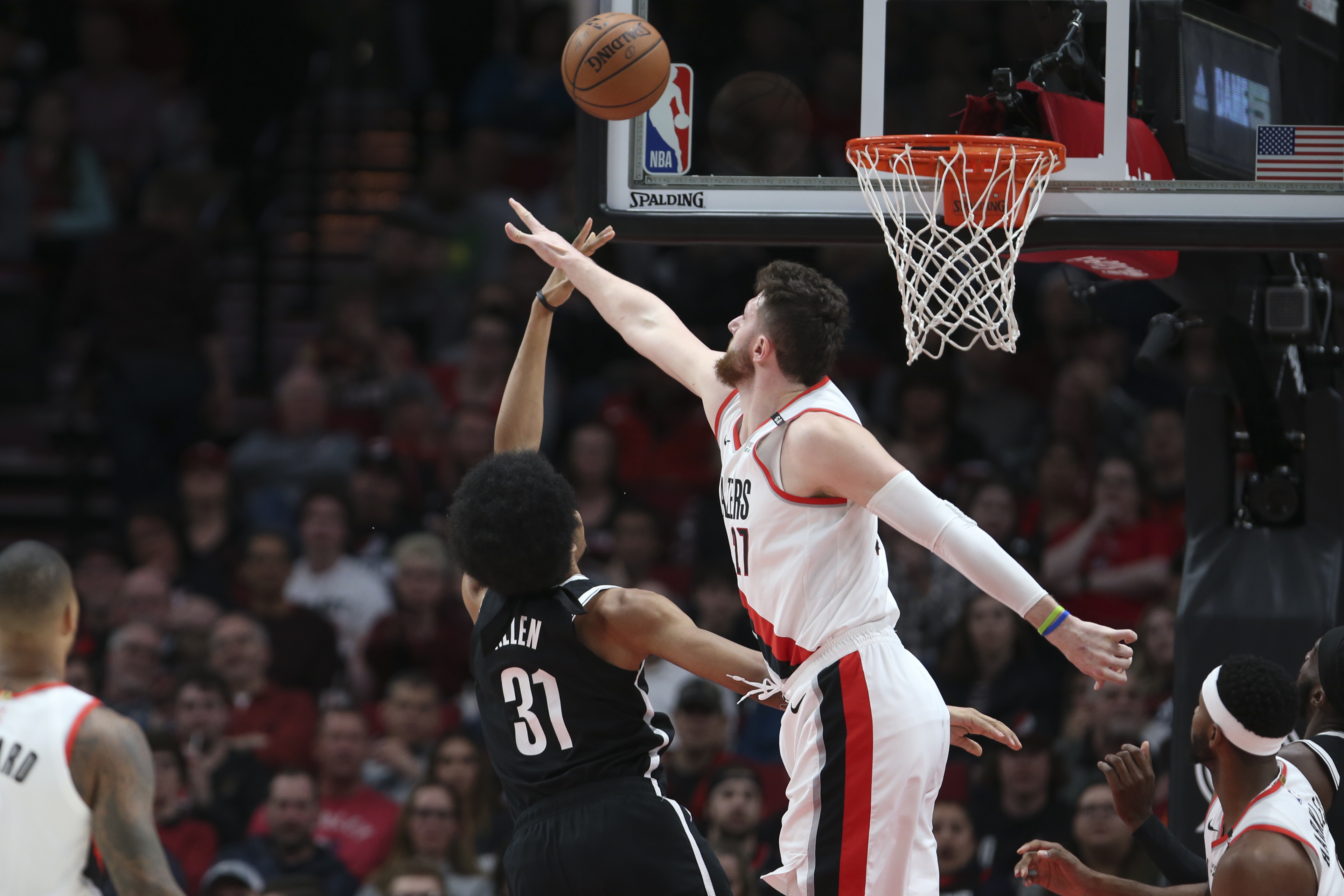 Blazers lose Nurkic to severe leg injury, edge Nets in 2 OTs