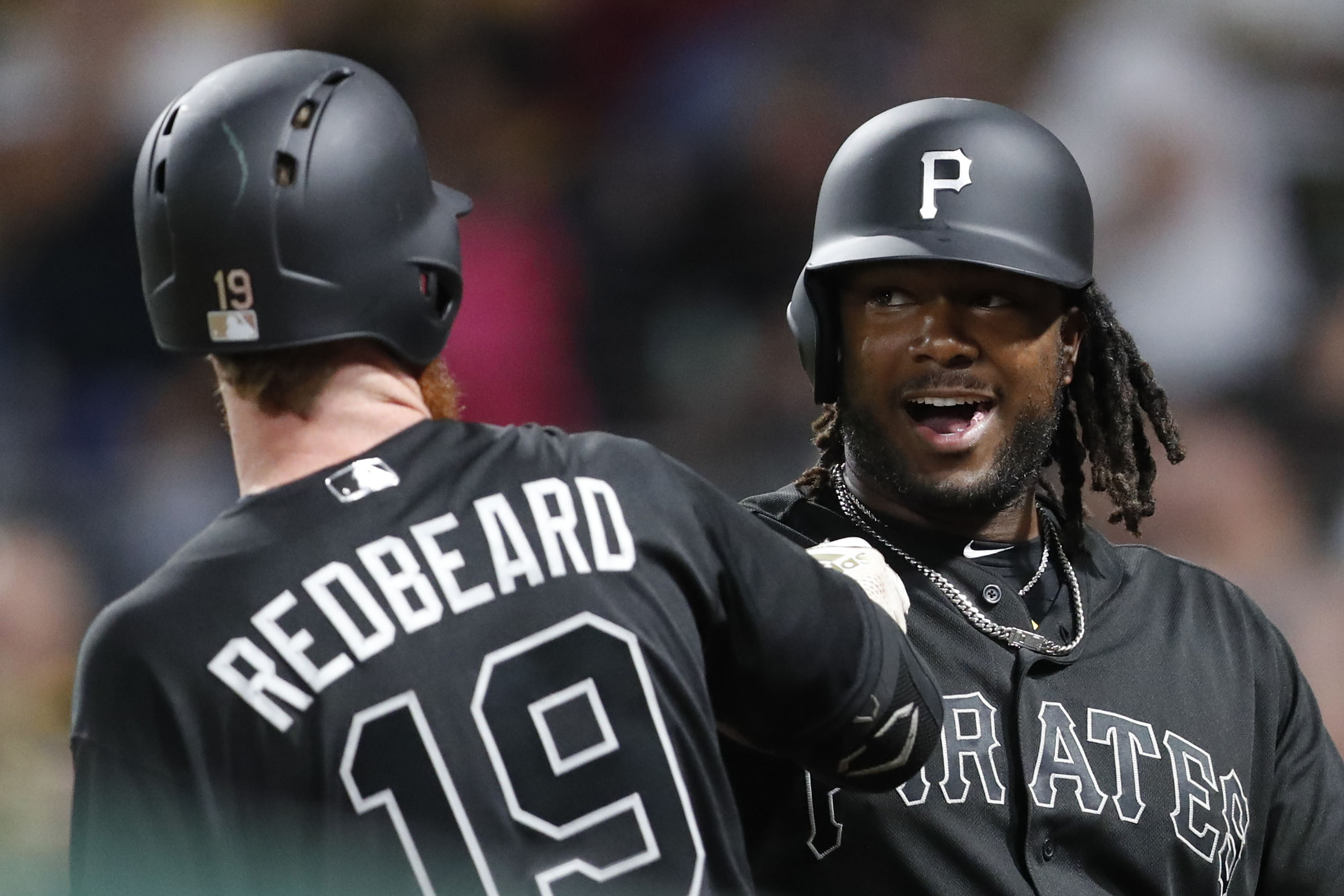 Bell tops 100 RBIs, Pirates cruise past Reds 14-0