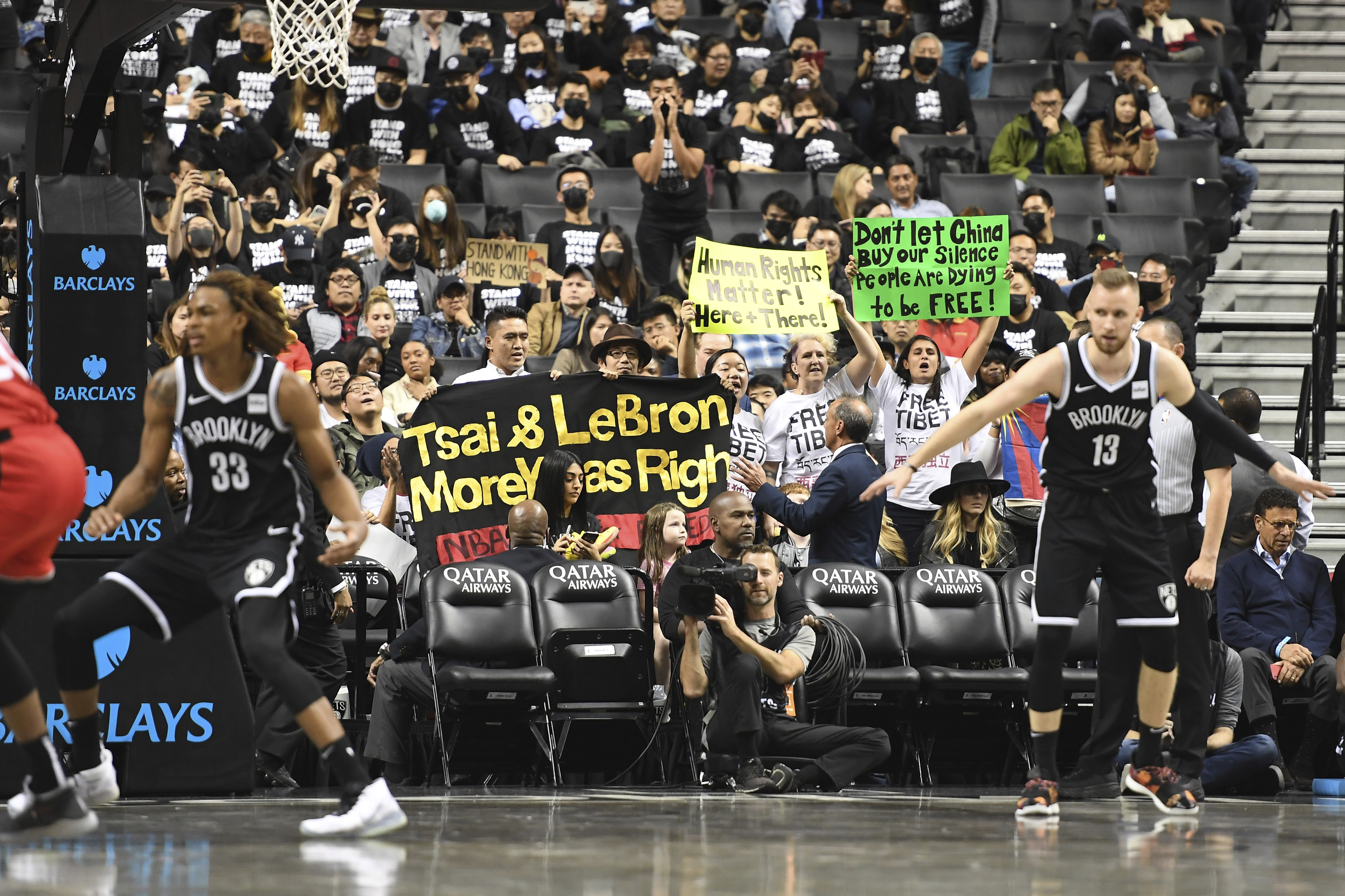 Fans support Hong Kong, Tibet at Nets' 1st game since China
