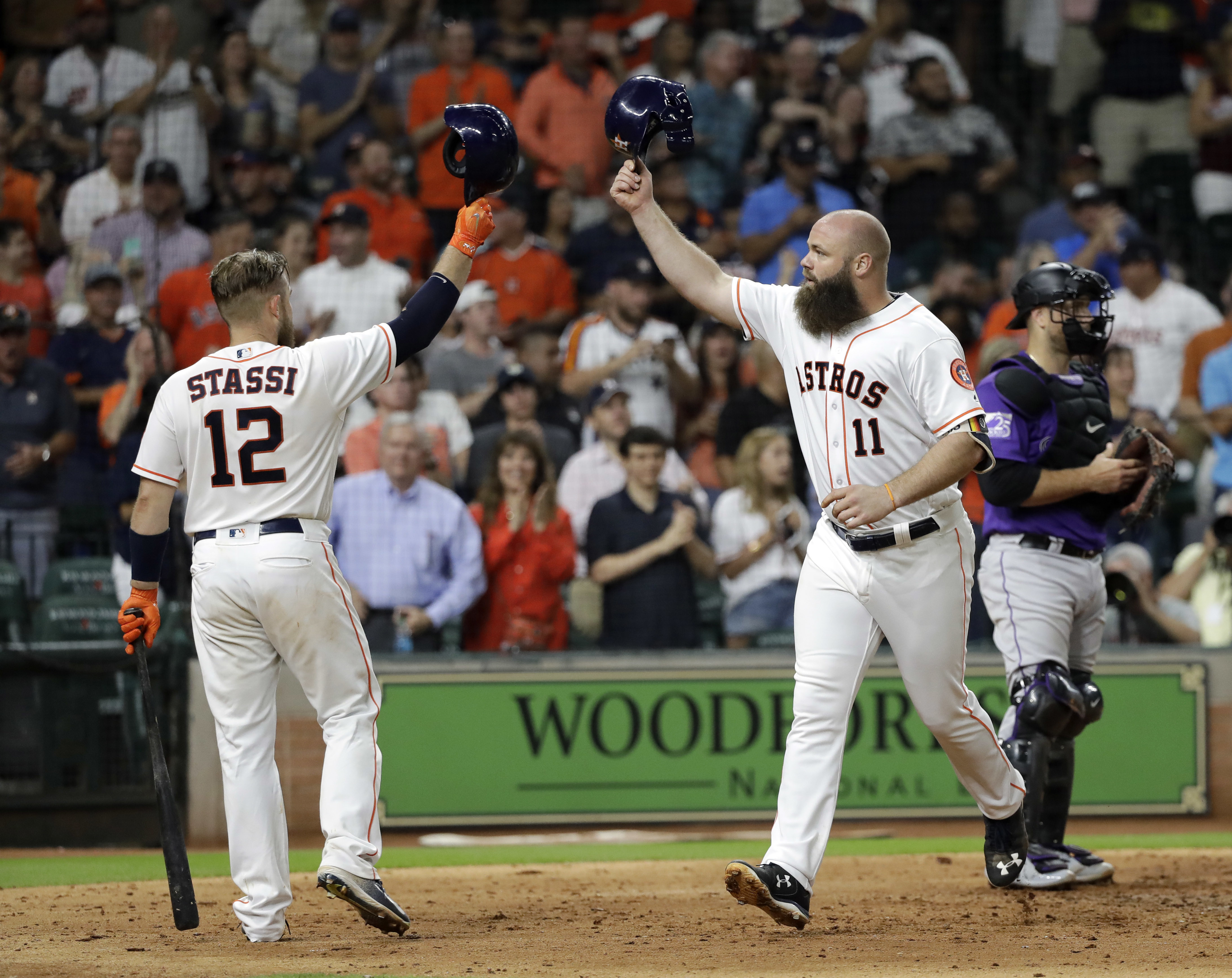 Astros hit 5 homers to end skid with 12-1 win over Rockies