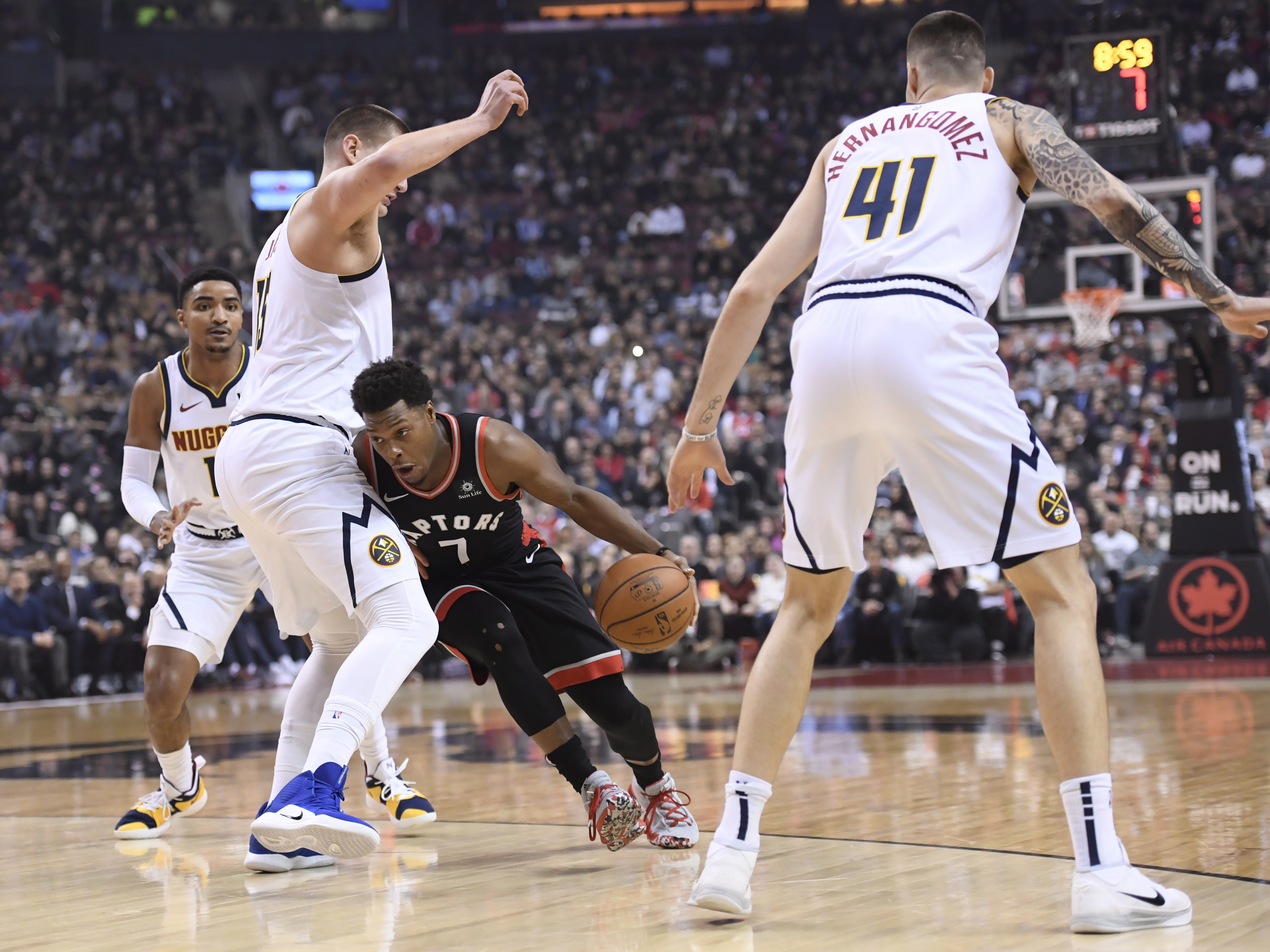 Jokic triple-double leads Nuggets past Raptors 106-103