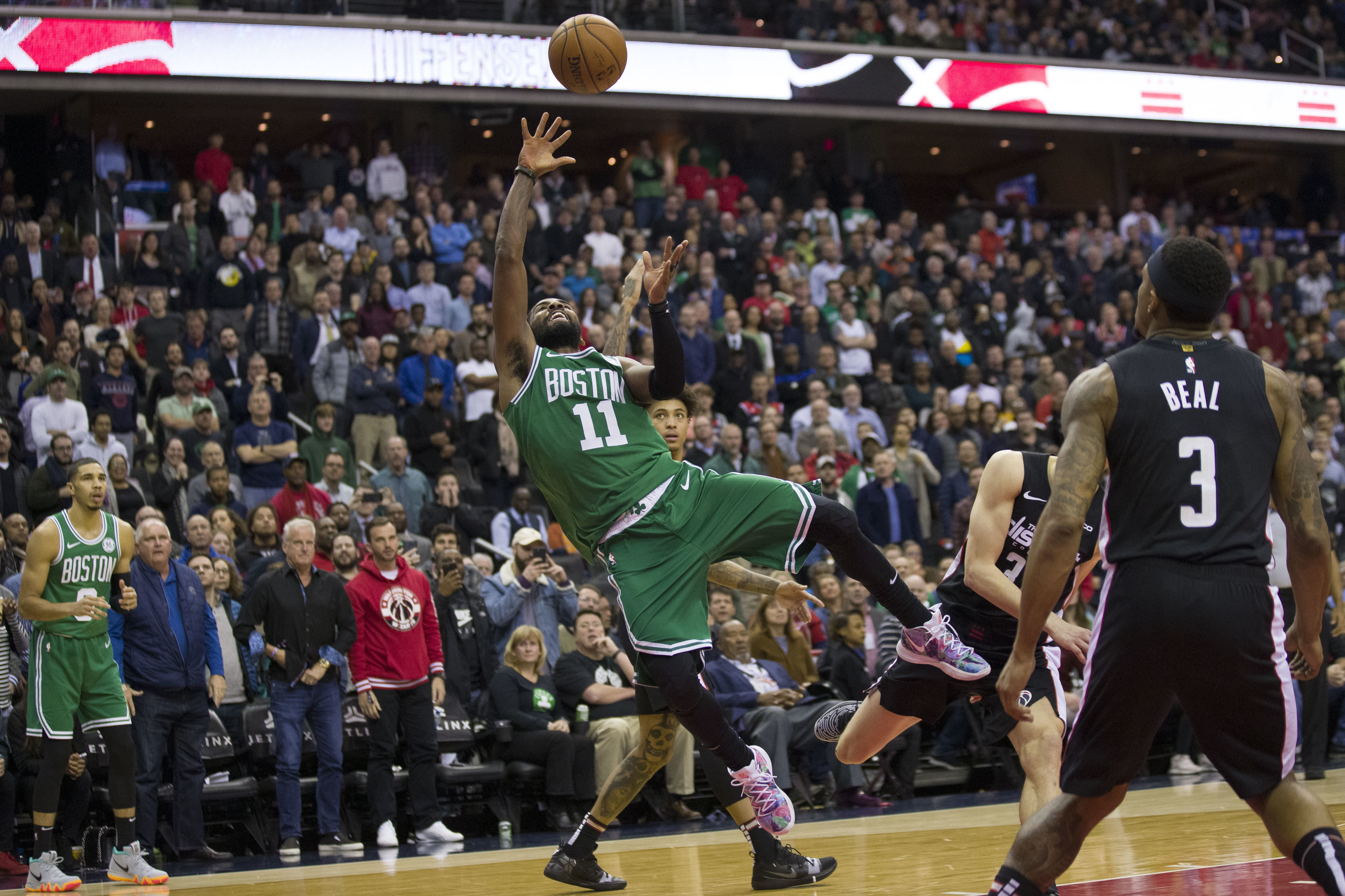 Irving helps Celtics past Wizards 130-125 in overtime