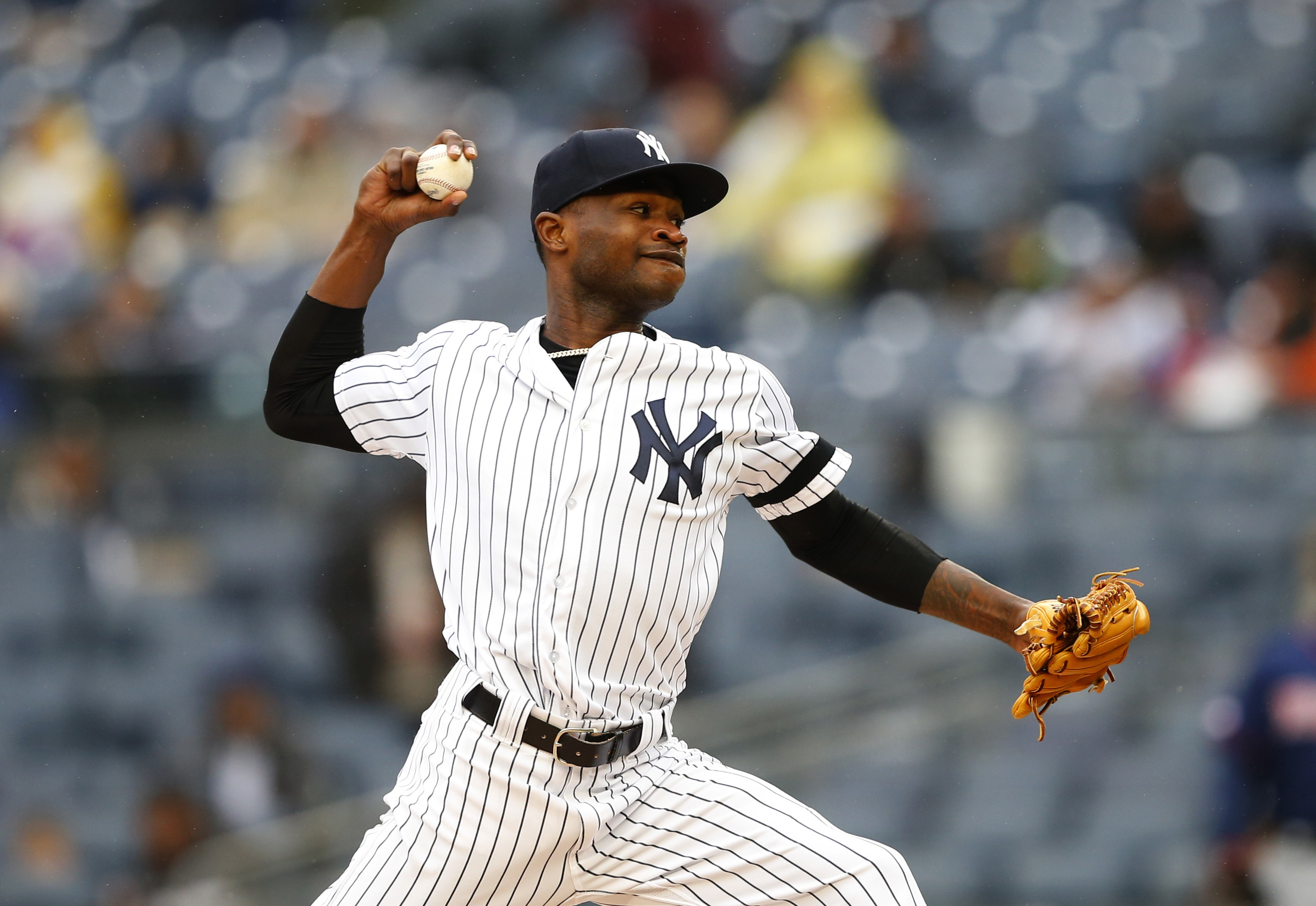 German wins again, Yanks top Twins 4-1 in rain-stopped game