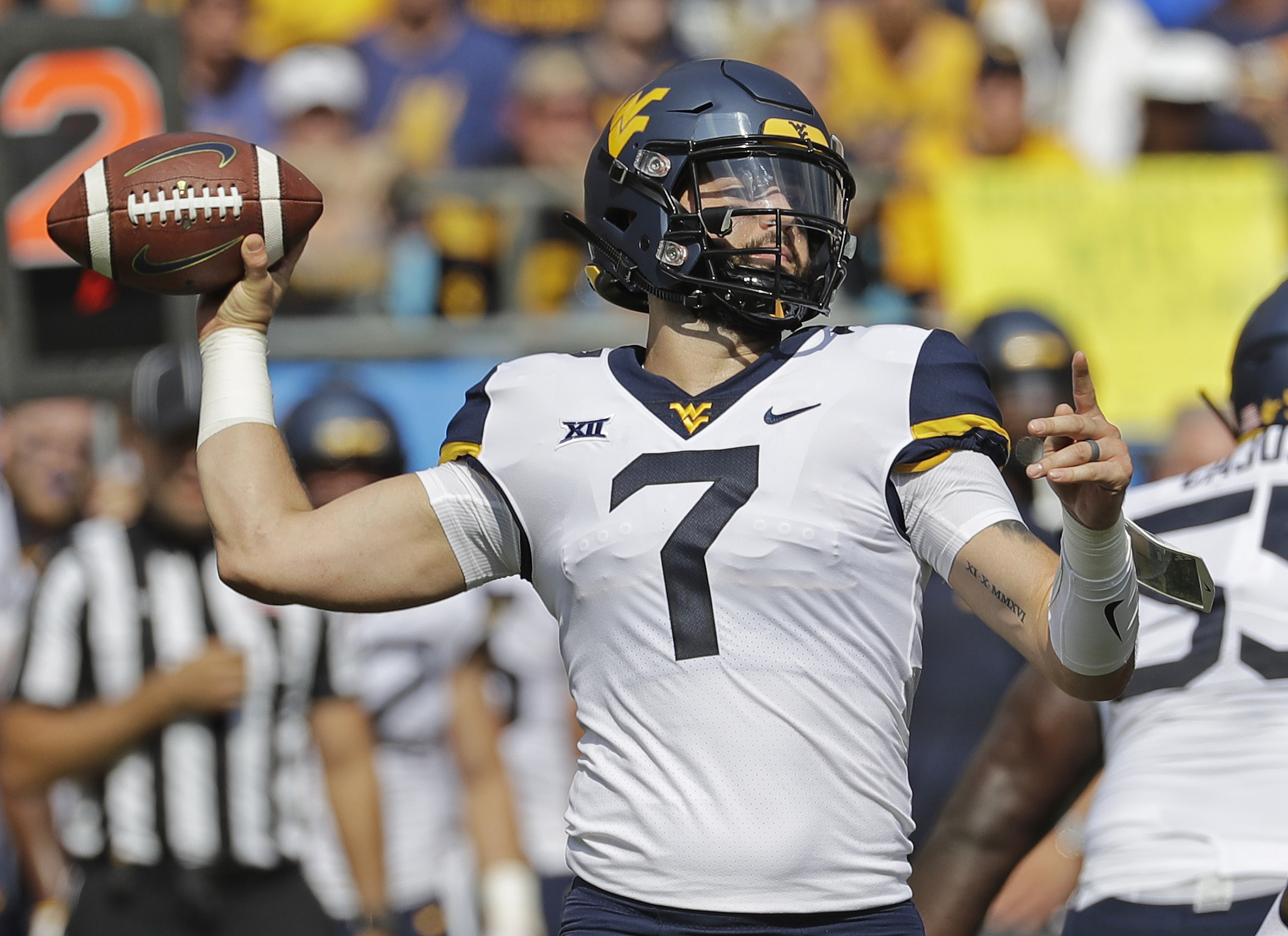 Grier leads No. 17 West Virginia past Tennessee 40-14