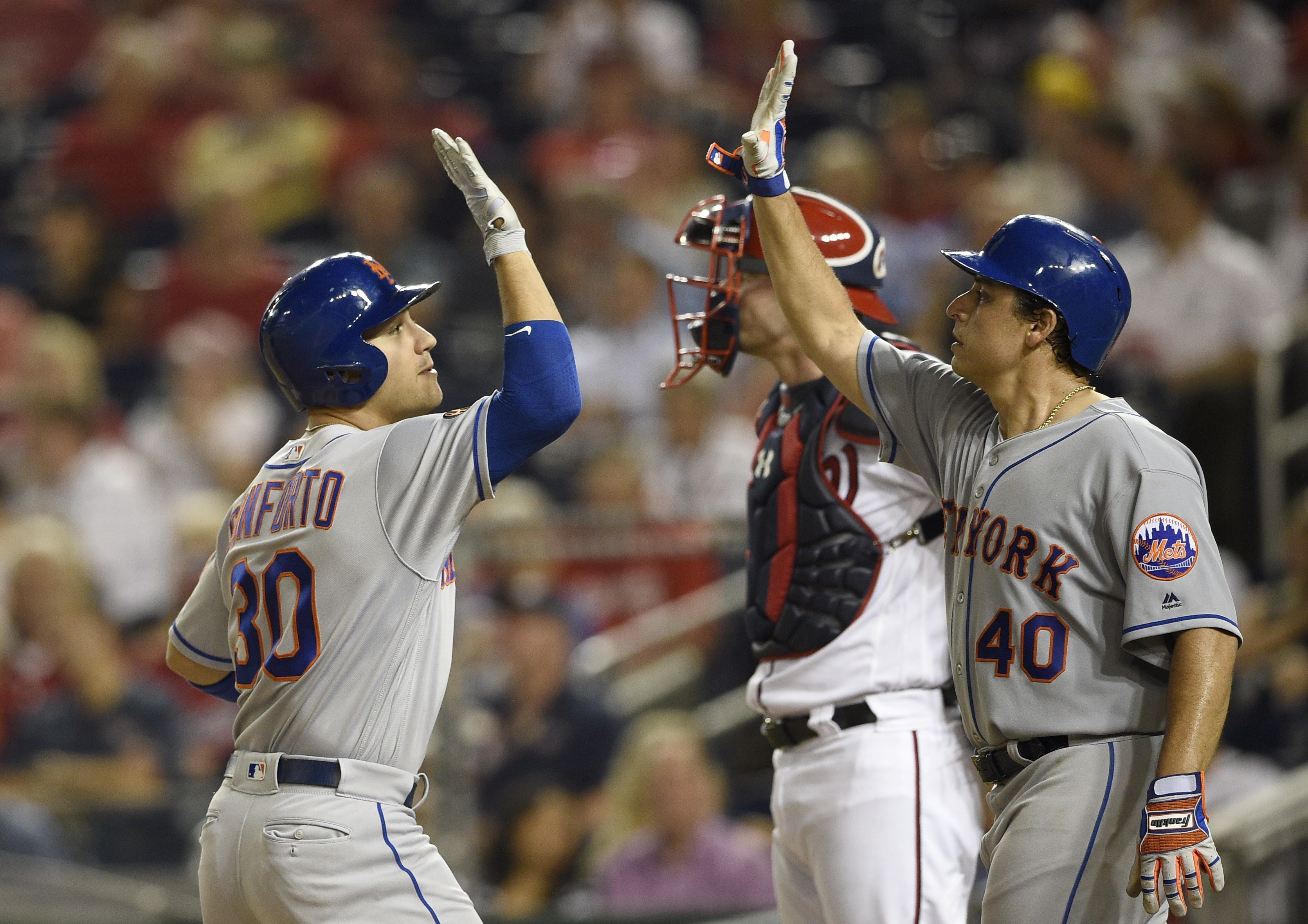 Lobaton’s sacrifice fly lifts Mets past Nationals in 12