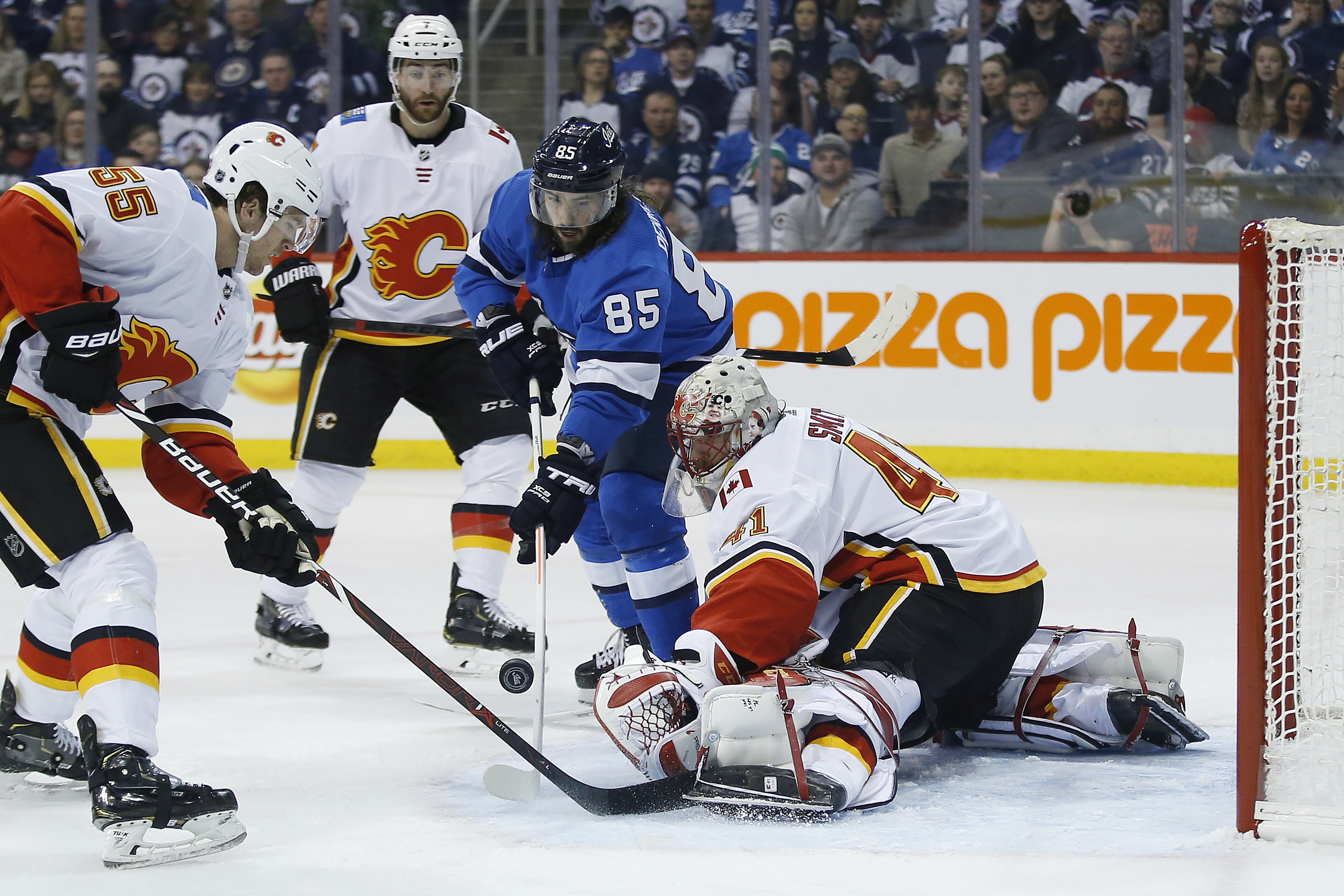 Scheifele, Hellebuyck lead Jets past Flames, 2-1