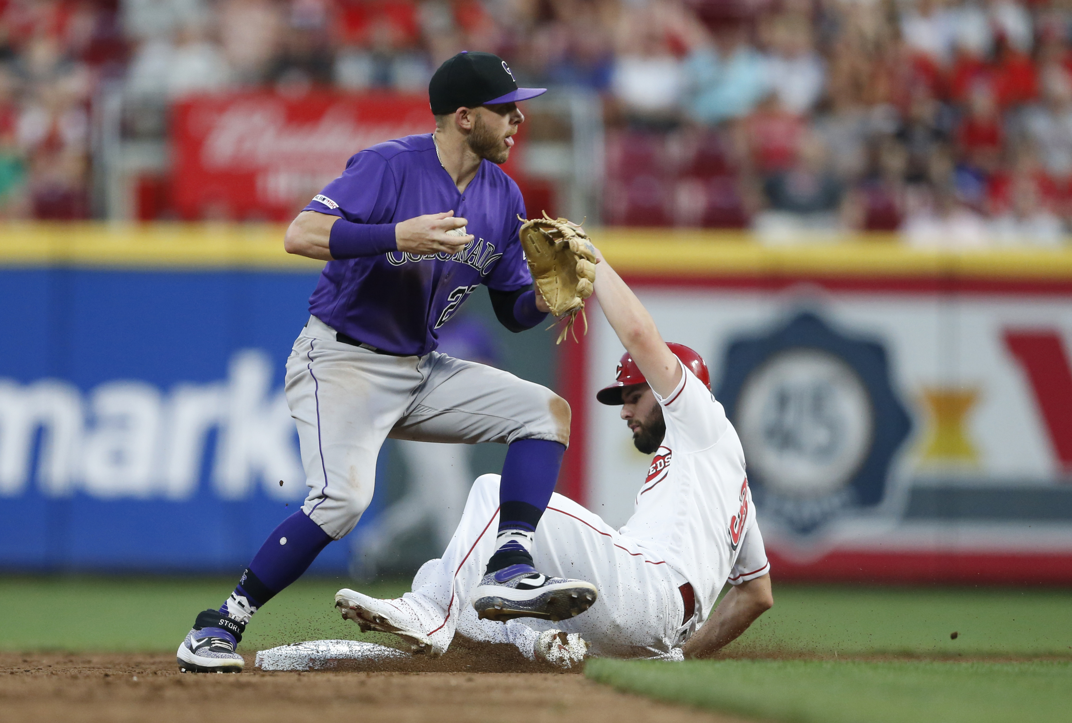 Suárez, VanMeter hit homers, Reds beat Rockies 3-1