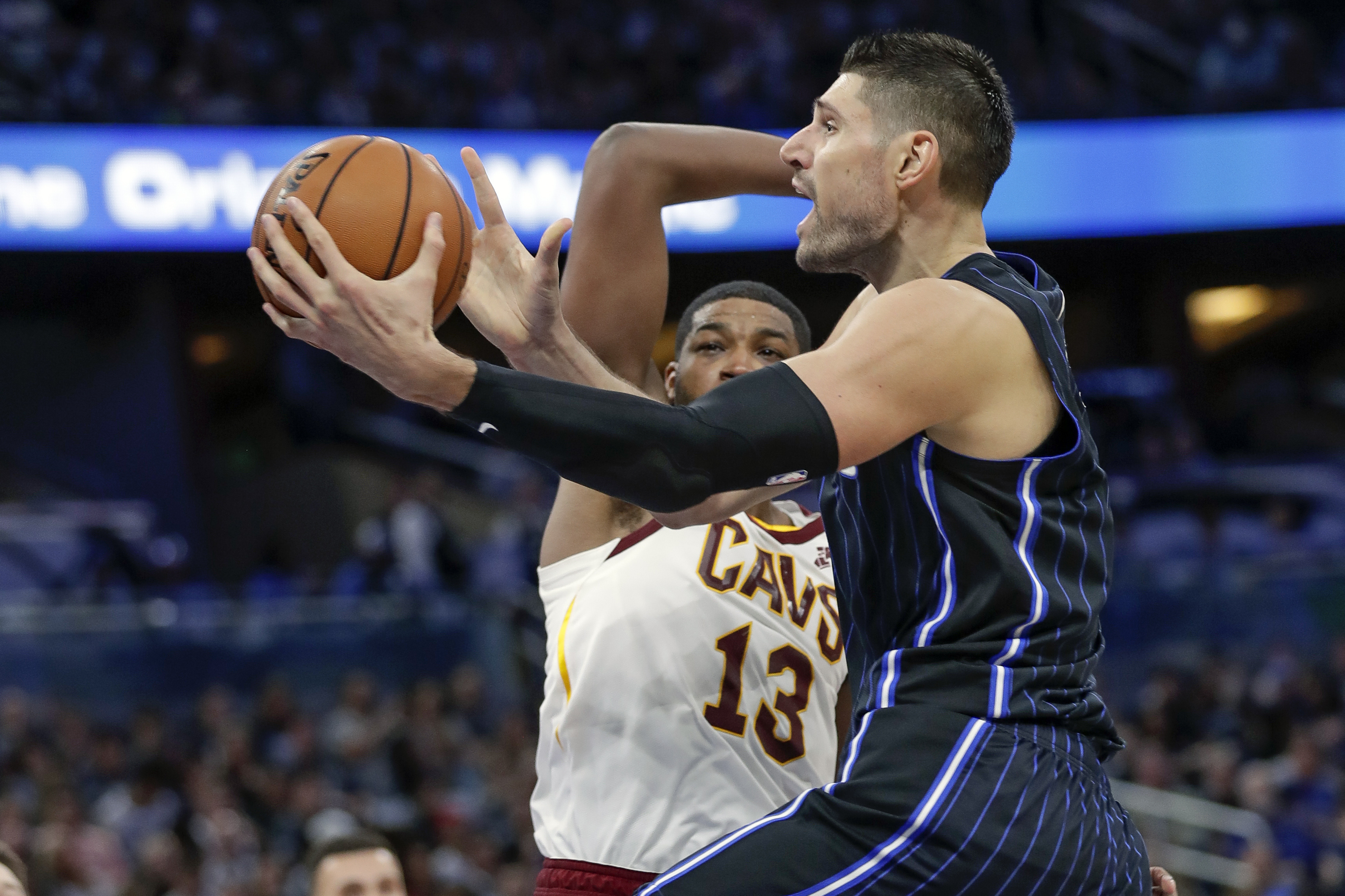 Magic, Vucevic beat Cavaliers in season opener