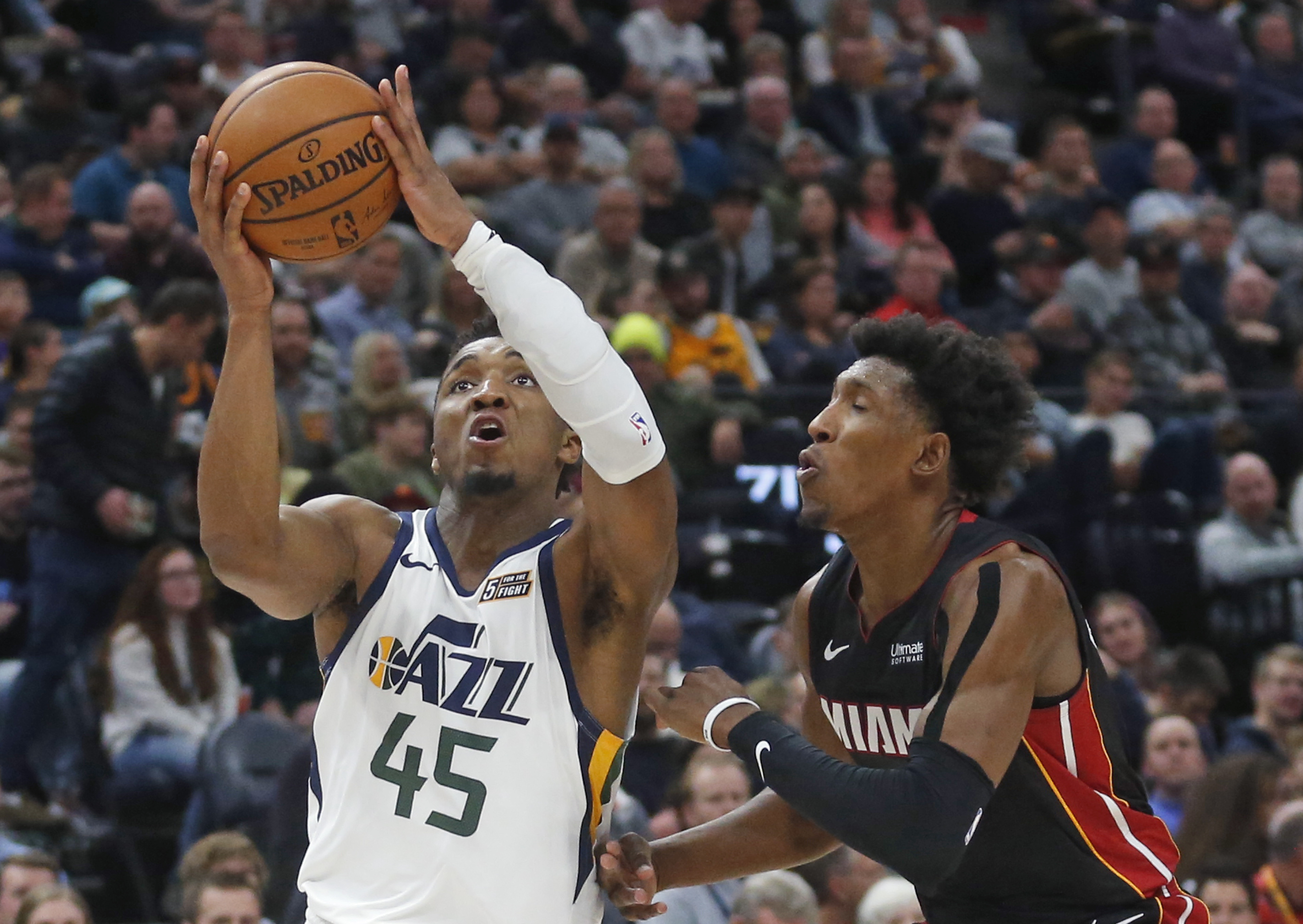 Mitchell, Jazz roll over short-handed Heat 111-84